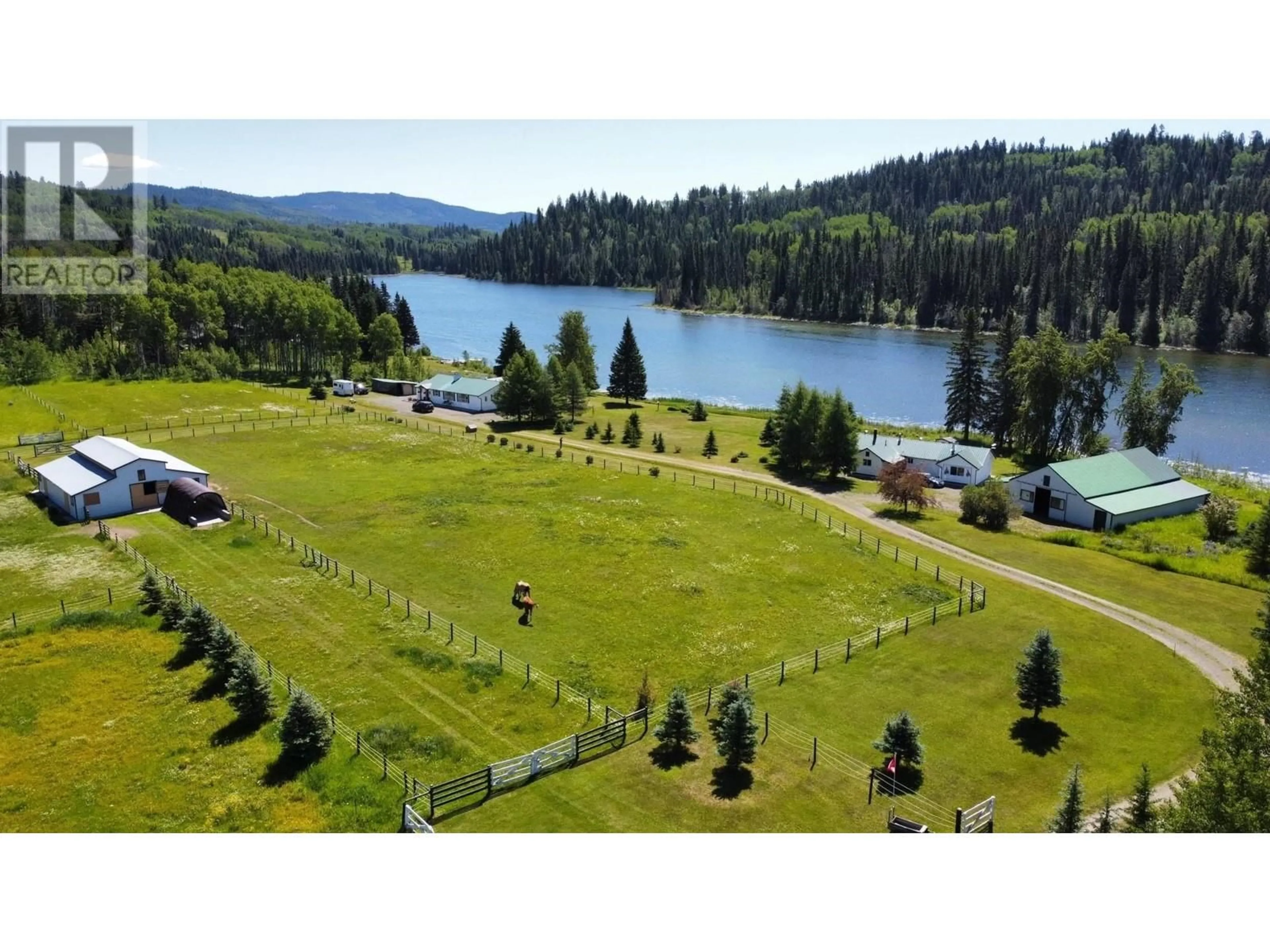 A pic from outside/outdoor area/front of a property/back of a property/a pic from drone, water/lake/river/ocean view for 8320 RAINBOW COUNTRY ROAD, Bridge Lake British Columbia V0K1X2