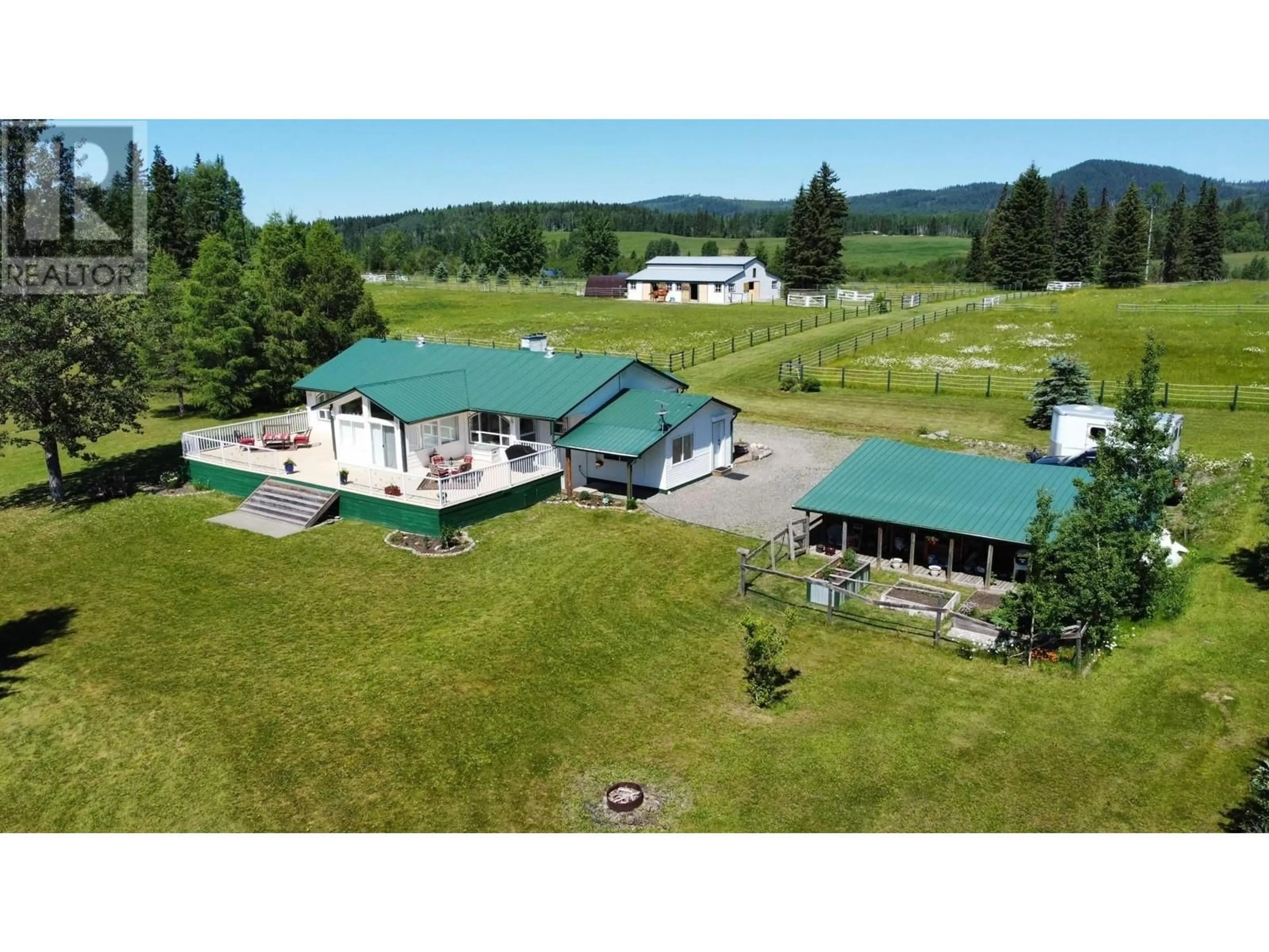 A pic from outside/outdoor area/front of a property/back of a property/a pic from drone, mountain view for 8320 RAINBOW COUNTRY ROAD, Bridge Lake British Columbia V0K1X2