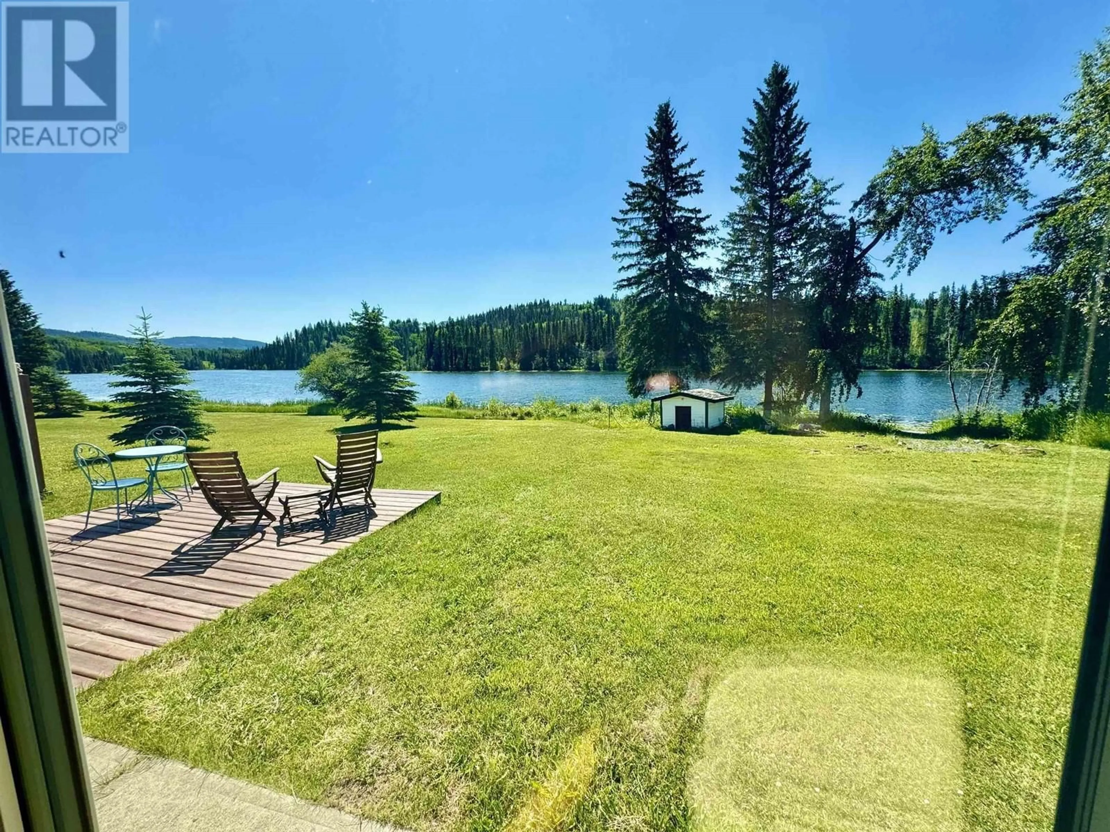 A pic from outside/outdoor area/front of a property/back of a property/a pic from drone, water/lake/river/ocean view for 8320 RAINBOW COUNTRY ROAD, Bridge Lake British Columbia V0K1X2