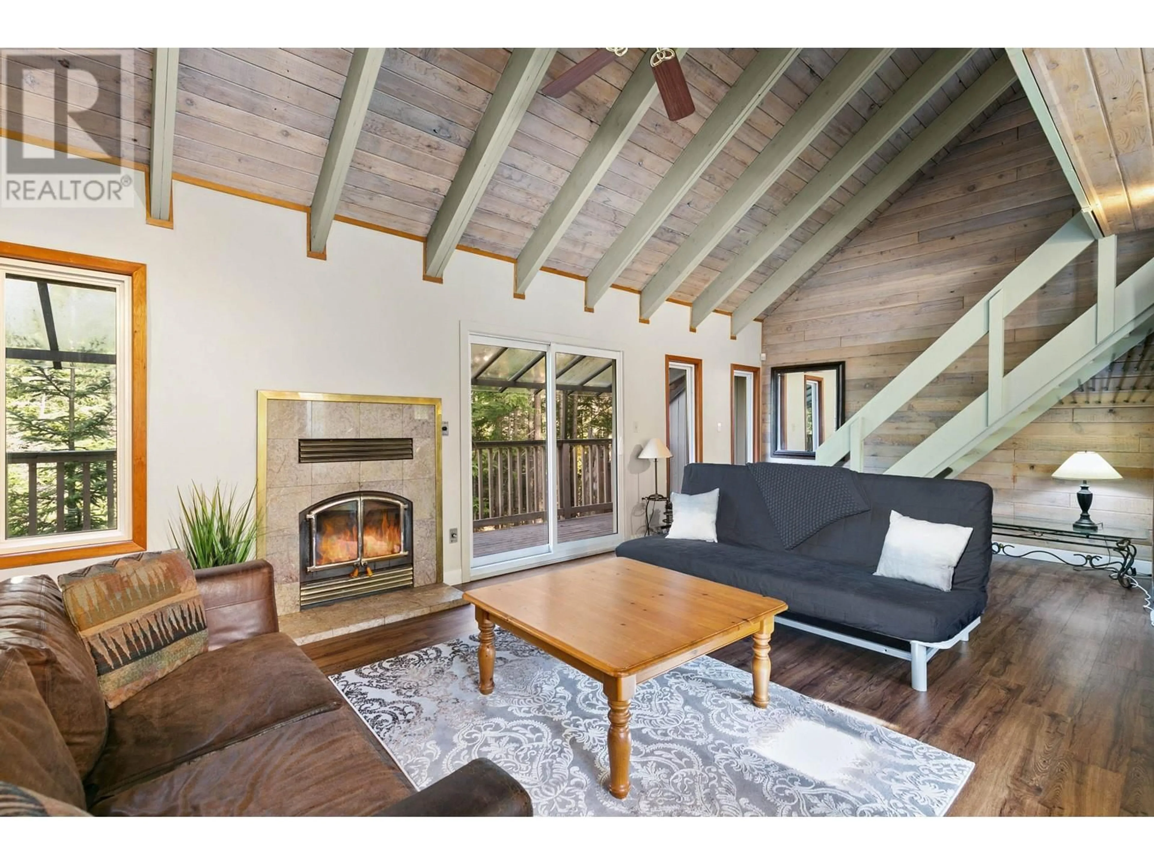 Living room with furniture, wood/laminate floor for 7063 NESTERS ROAD, Whistler British Columbia V8E0E2