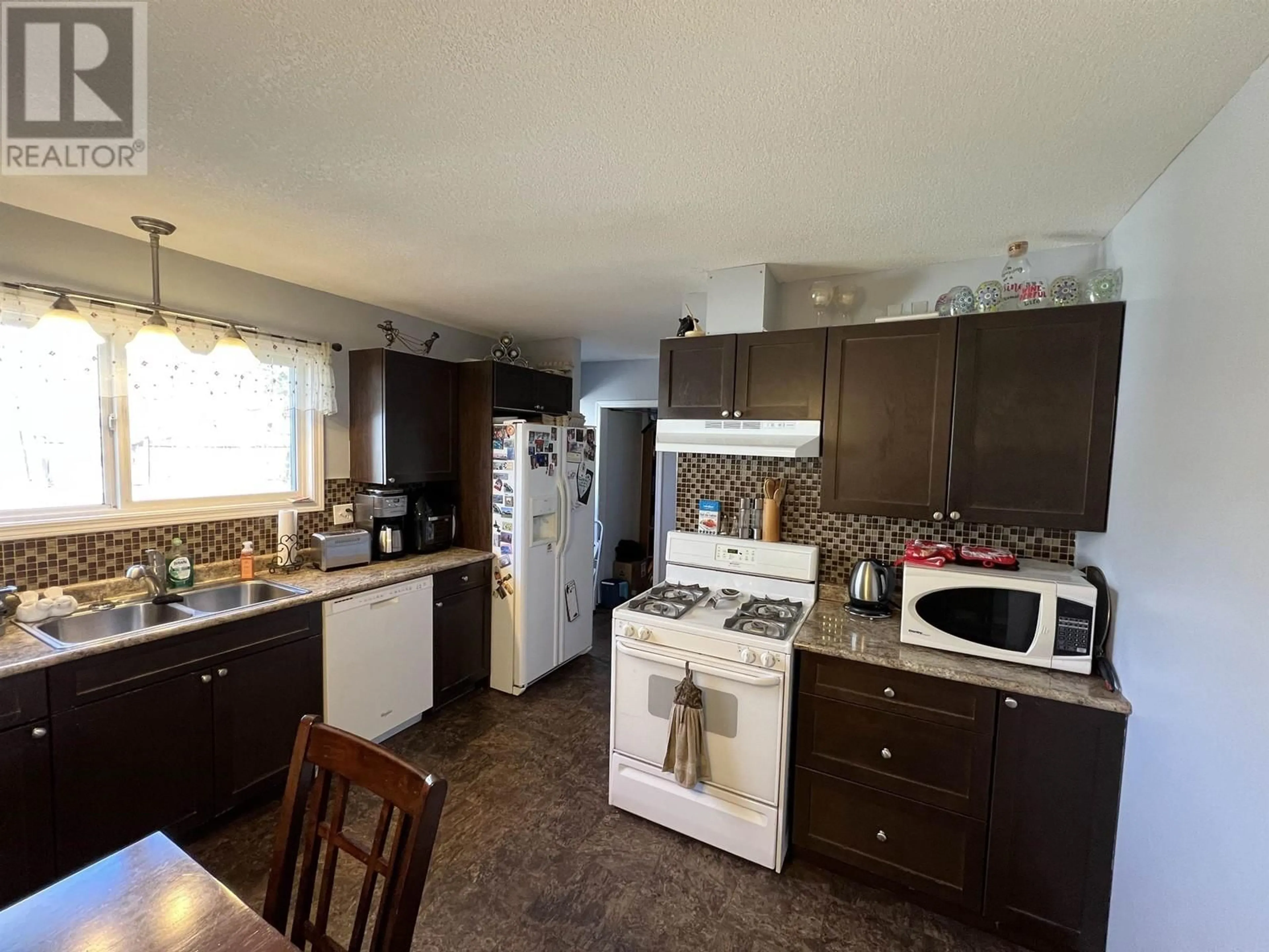 Standard kitchen, wood/laminate floor for 5435 AIRPORT DRIVE, Fort Nelson British Columbia V0C1R0