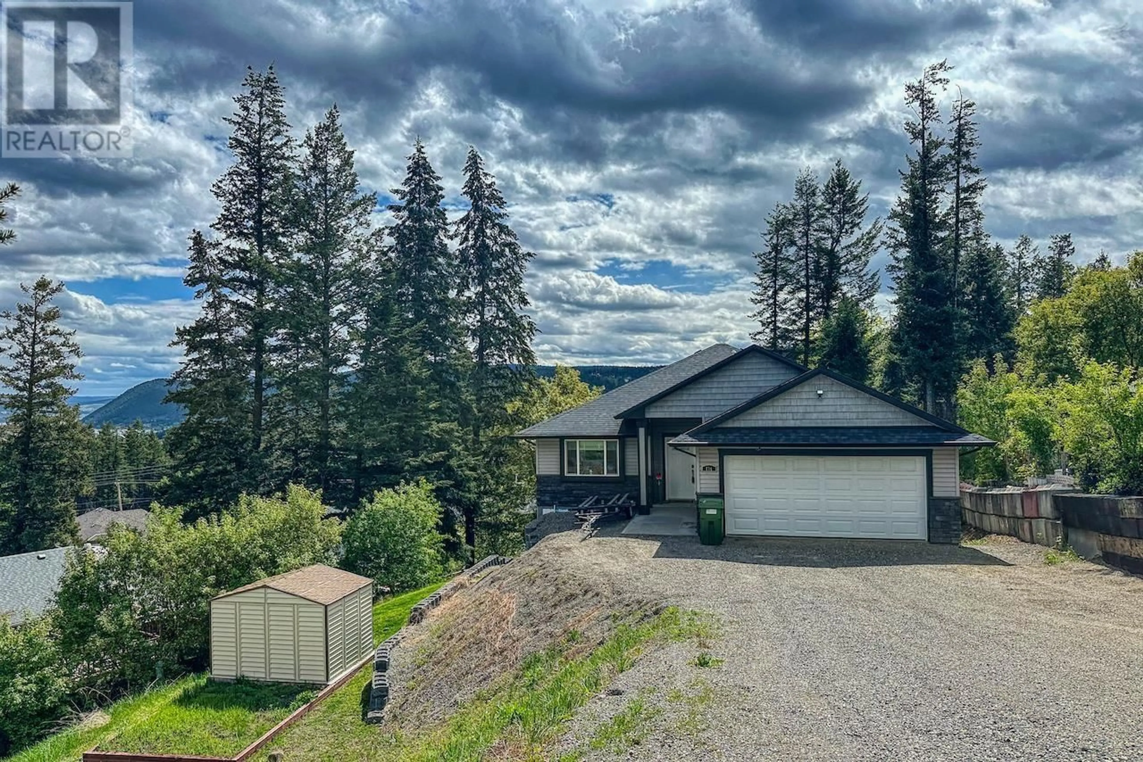 A pic from outside/outdoor area/front of a property/back of a property/a pic from drone, mountain view for 124 RIDGEVIEW PLACE, Williams Lake British Columbia V2G5K4