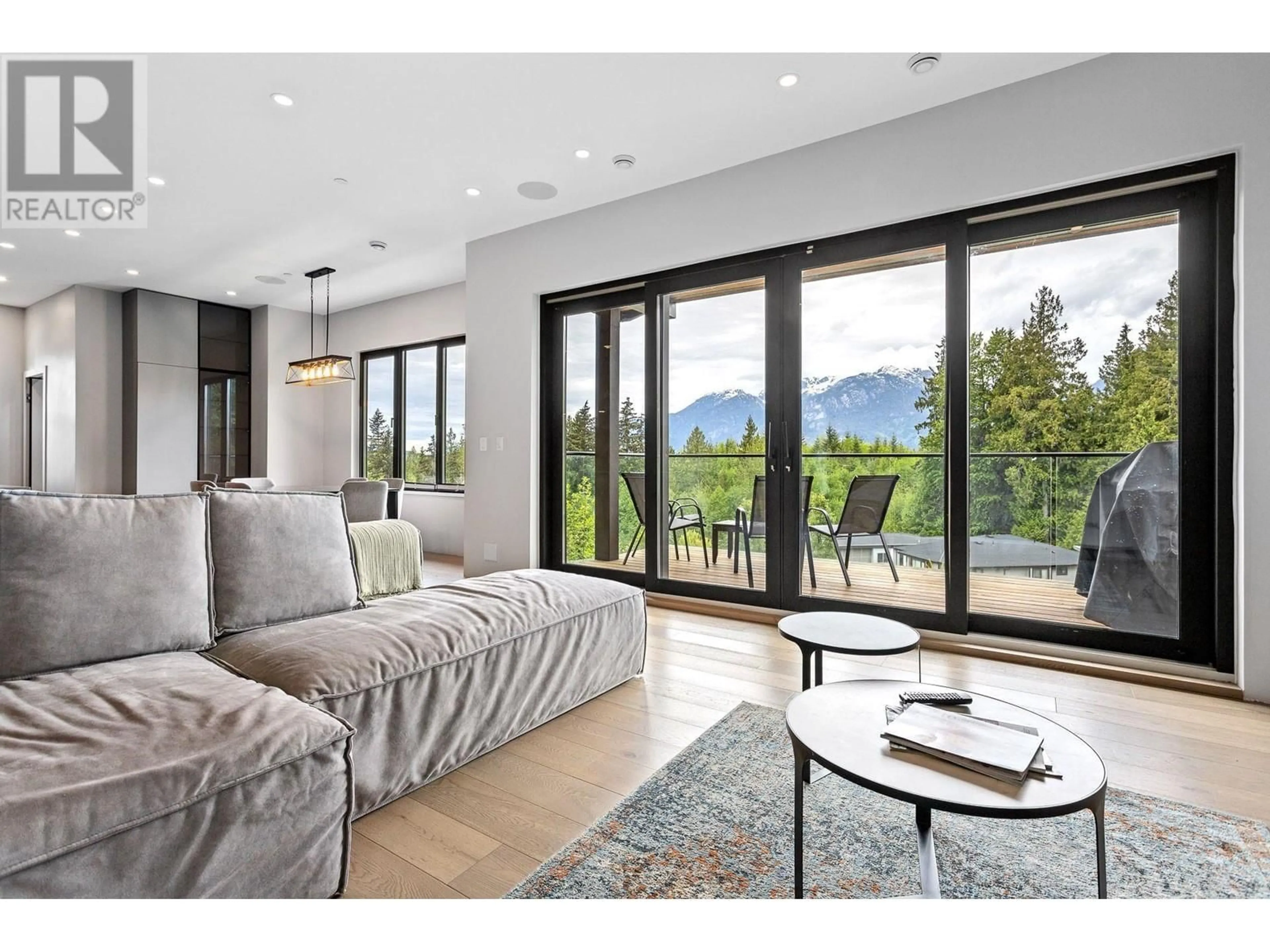 Living room with furniture, wood/laminate floor for 33 - 3385 MAMQUAM ROAD, Squamish British Columbia V8B0E3