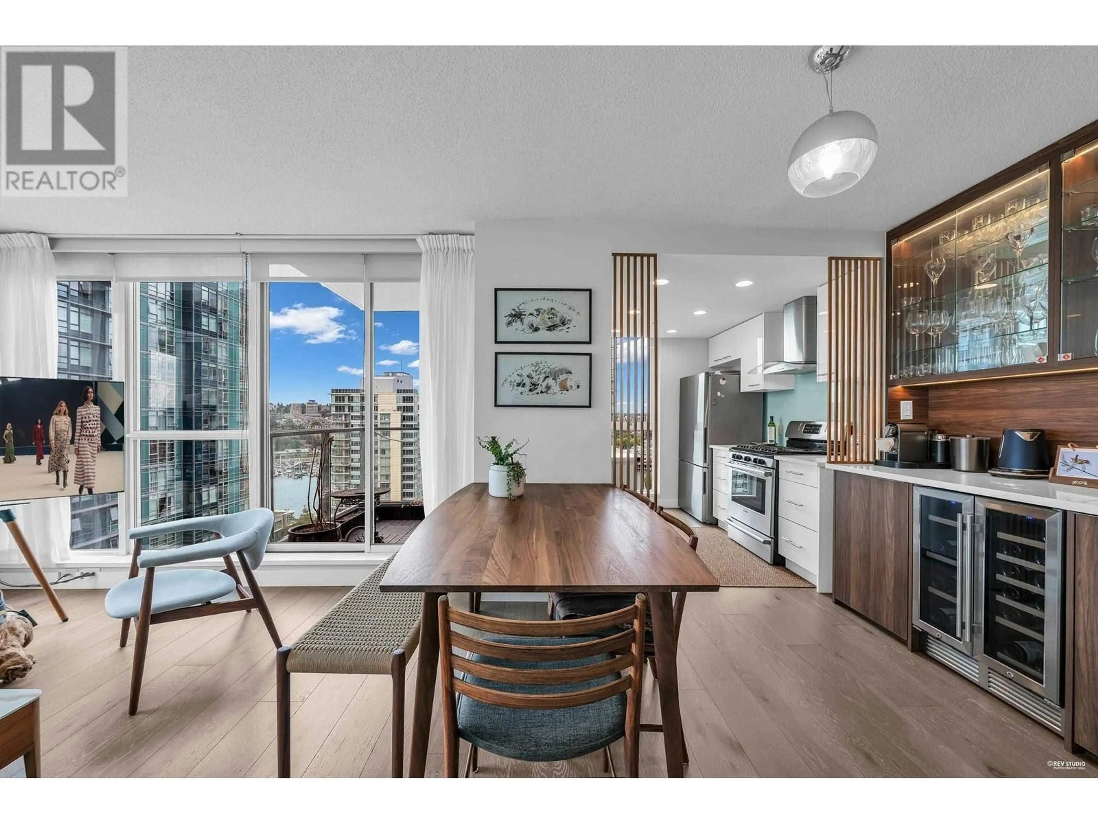 Open concept kitchen, wood/laminate floor for 1802 - 1408 STRATHMORE MEWS, Vancouver British Columbia V6Z3A9