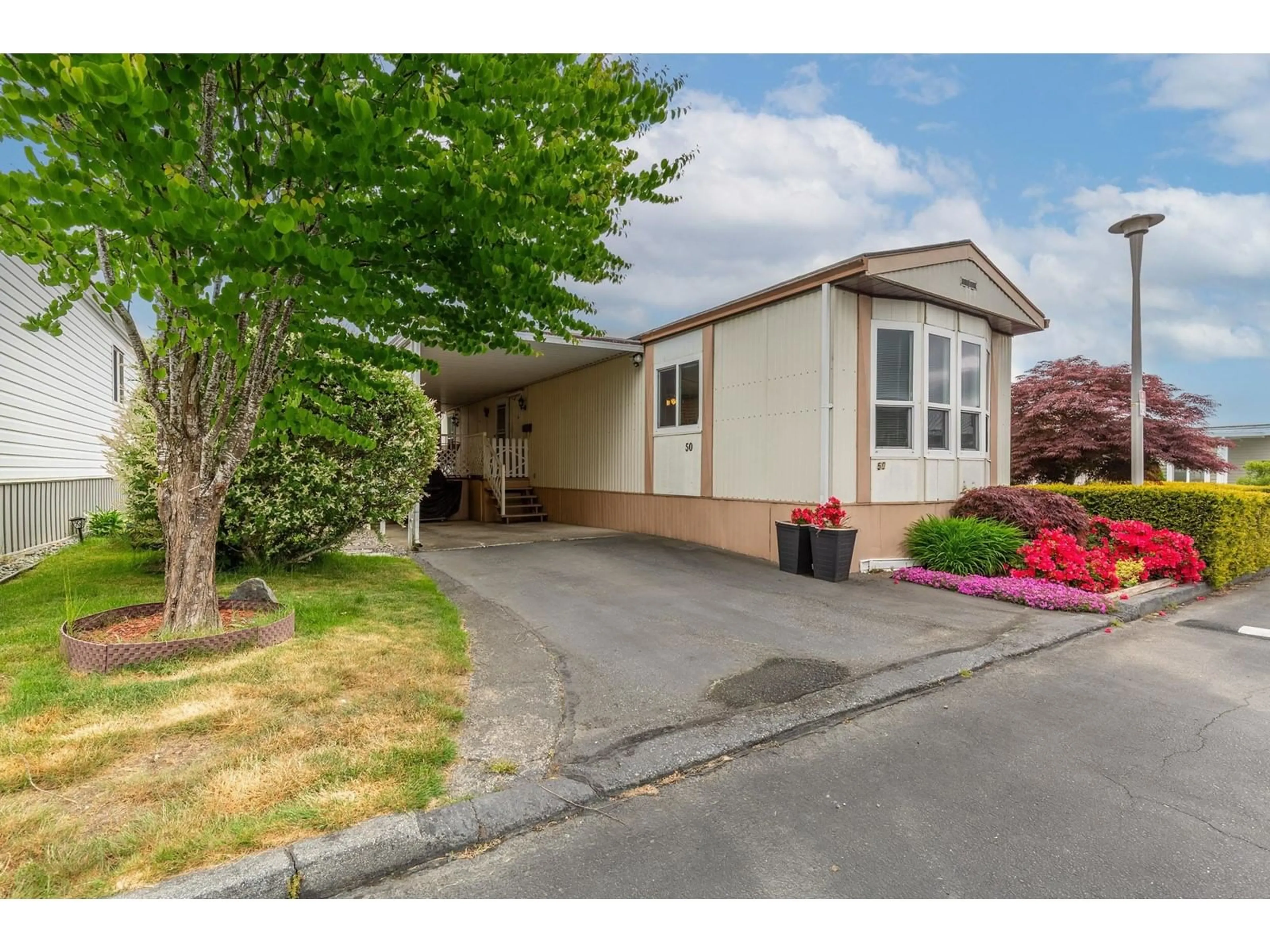 Home with vinyl exterior material, street for 50 - 8254 134TH, Surrey British Columbia V3W6M2