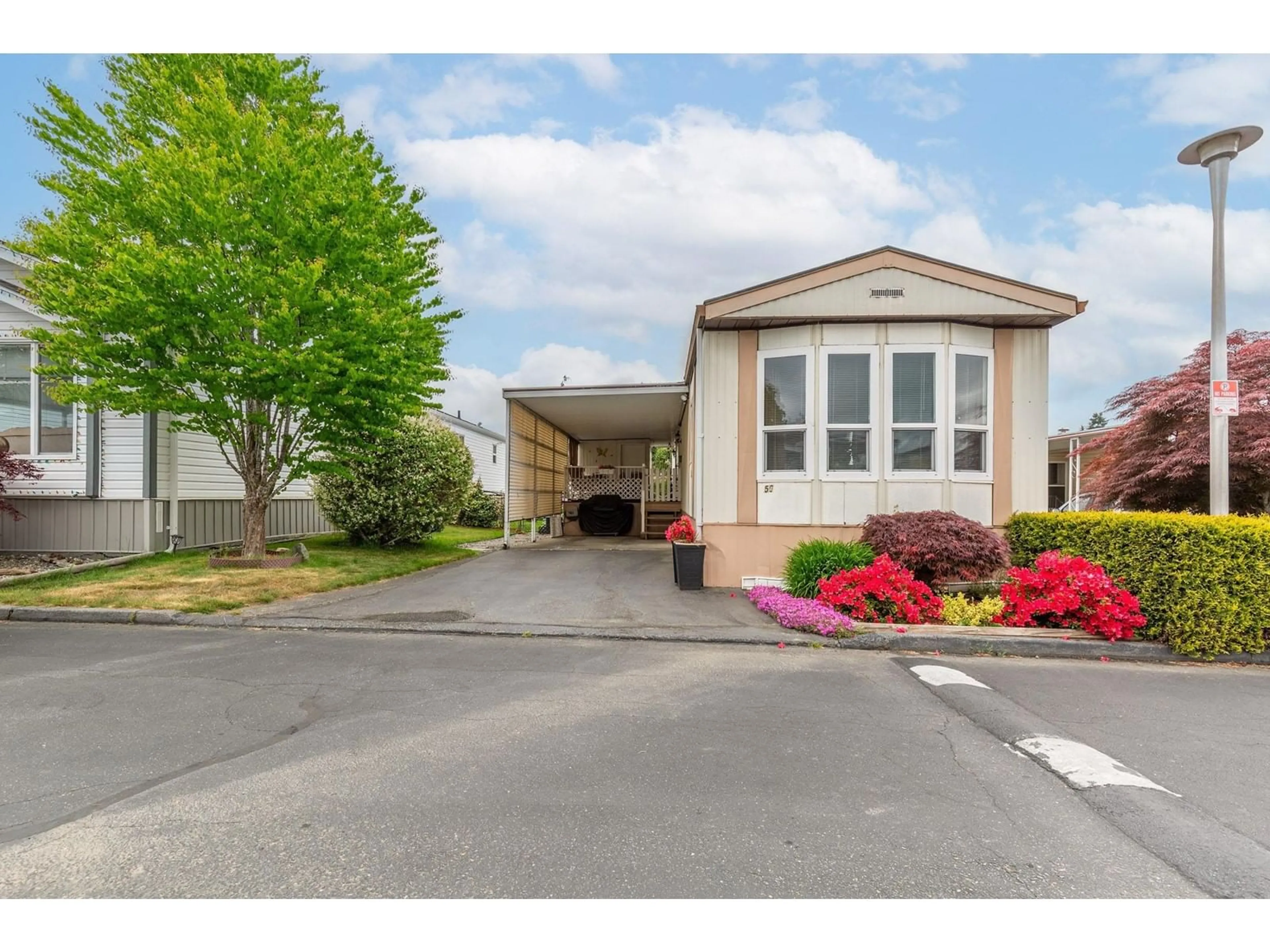 Home with vinyl exterior material, street for 50 - 8254 134TH, Surrey British Columbia V3W6M2
