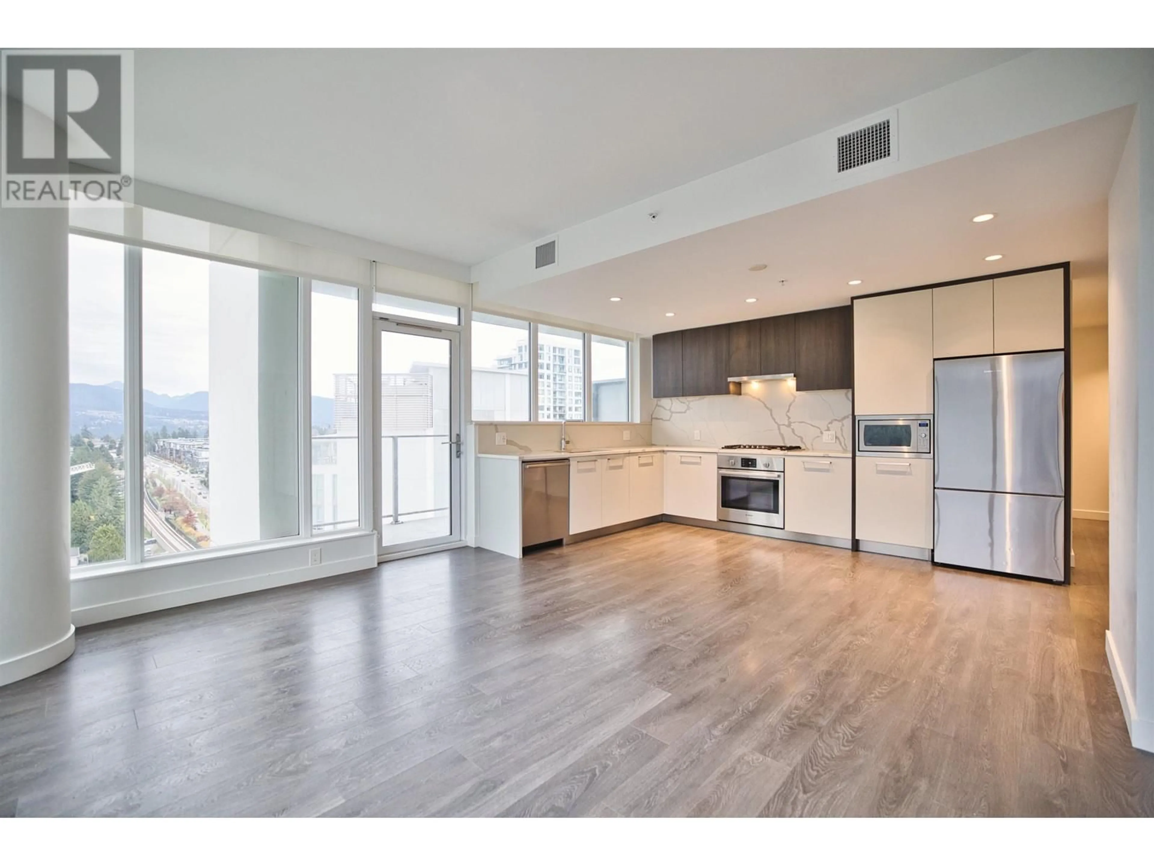 Open concept kitchen, wood/laminate floor for 1604 - 567 CLARKE ROAD, Coquitlam British Columbia V3J0K7