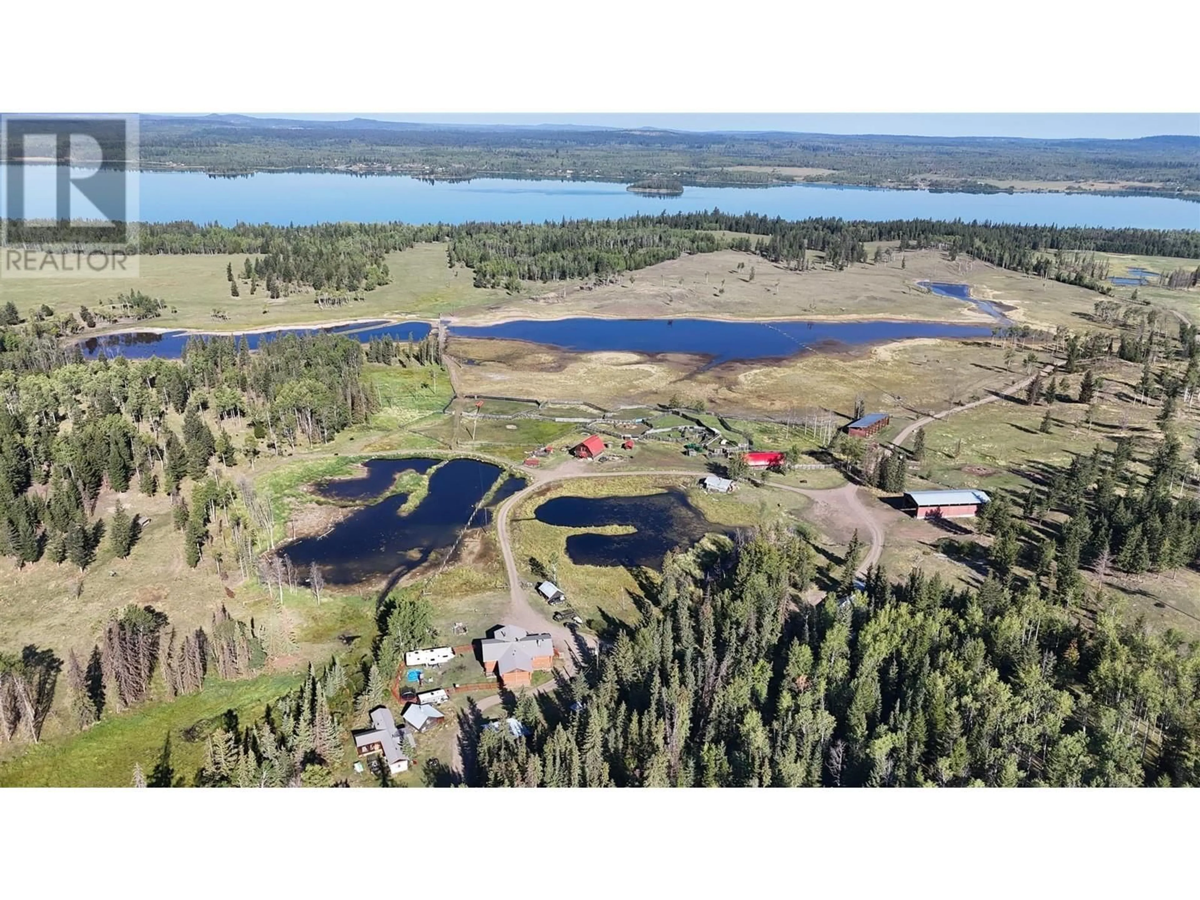 A pic from outside/outdoor area/front of a property/back of a property/a pic from drone, water/lake/river/ocean view for 938 GREEN LAKE ROAD, 70 Mile House British Columbia V0K2K2