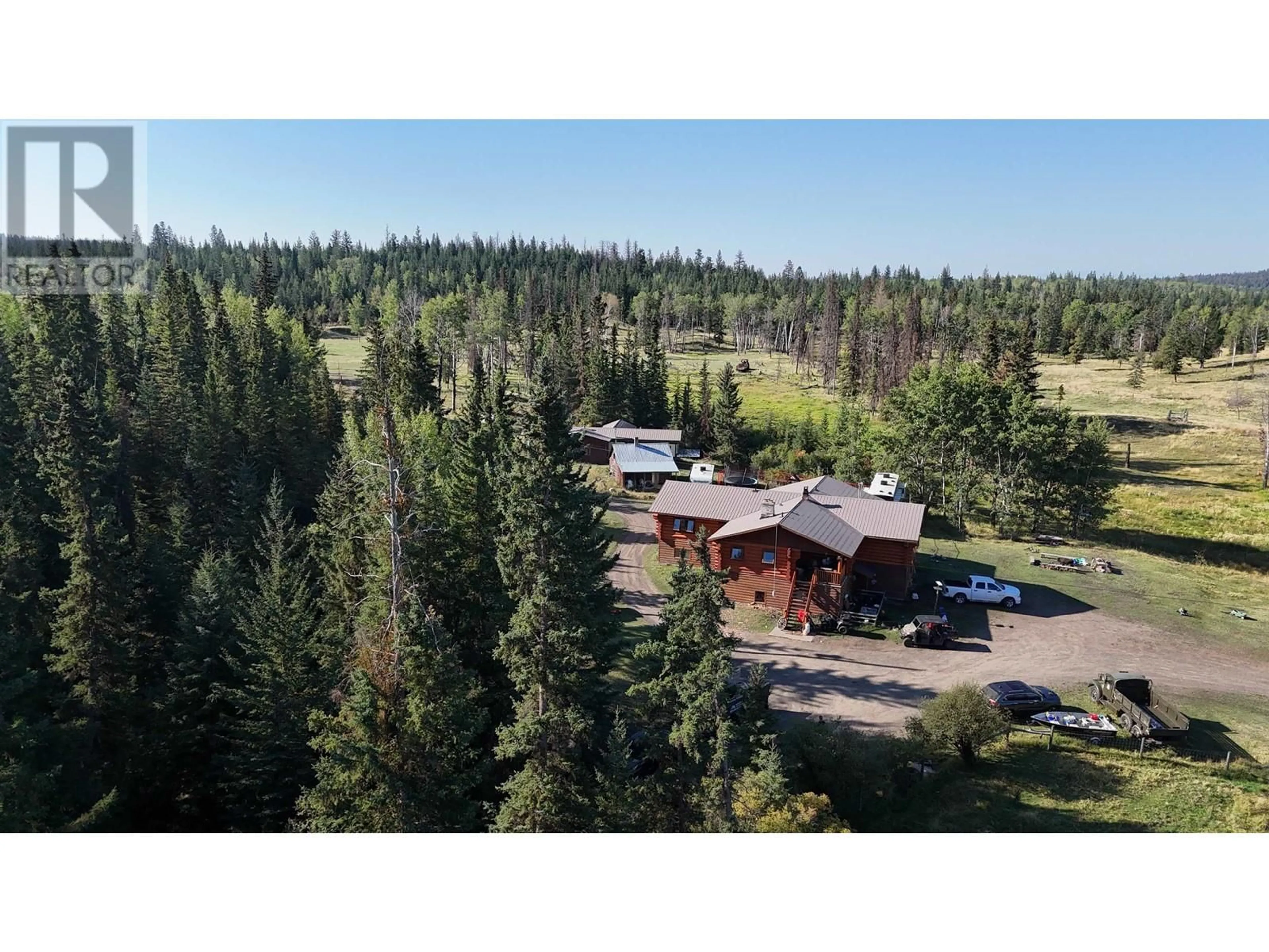 A pic from outside/outdoor area/front of a property/back of a property/a pic from drone, forest/trees view for 938 GREEN LAKE ROAD, 70 Mile House British Columbia V0K2K2