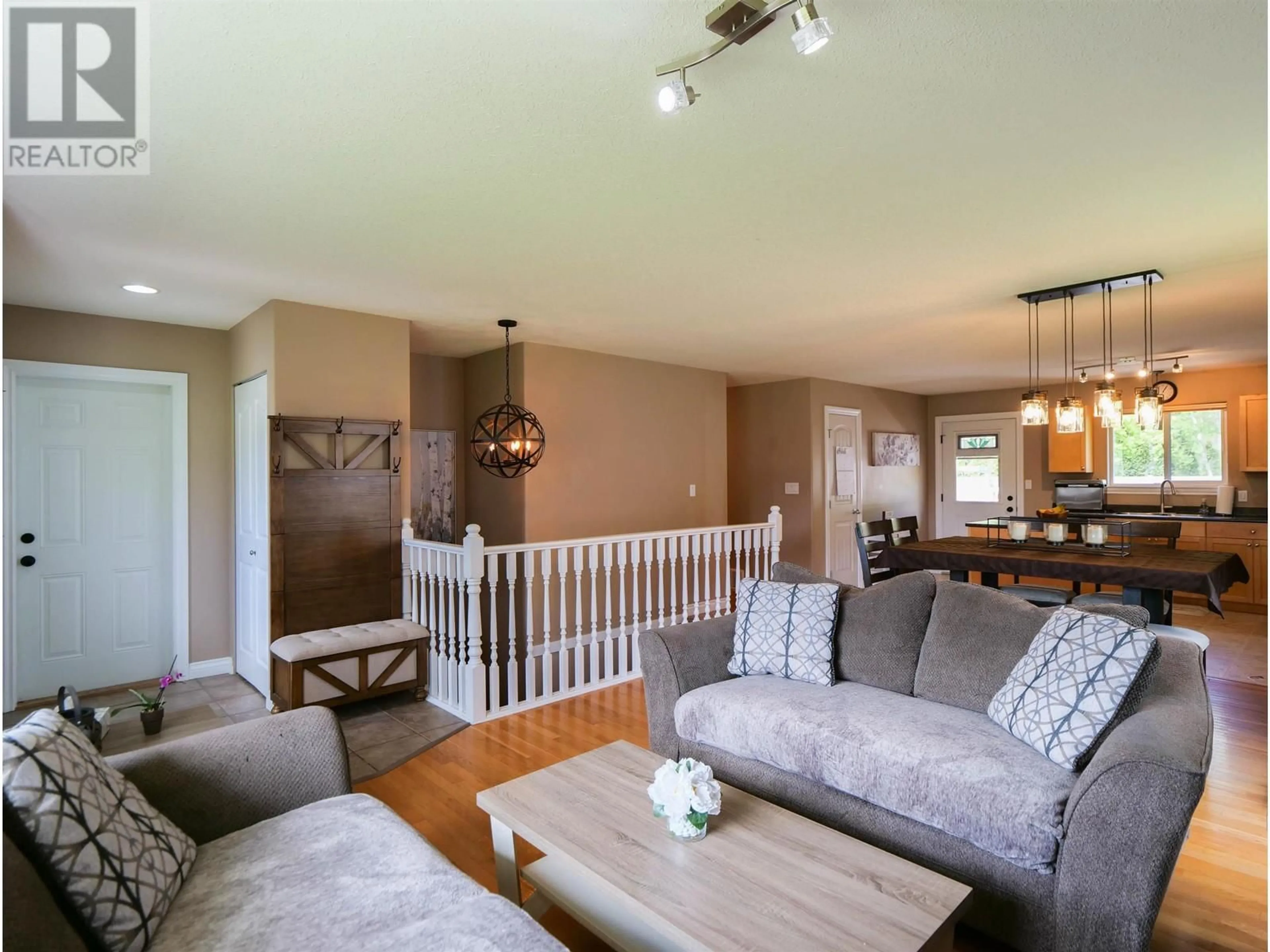 Living room with furniture, wood/laminate floor for 1311 NASON STREET, Quesnel British Columbia V2J6B4