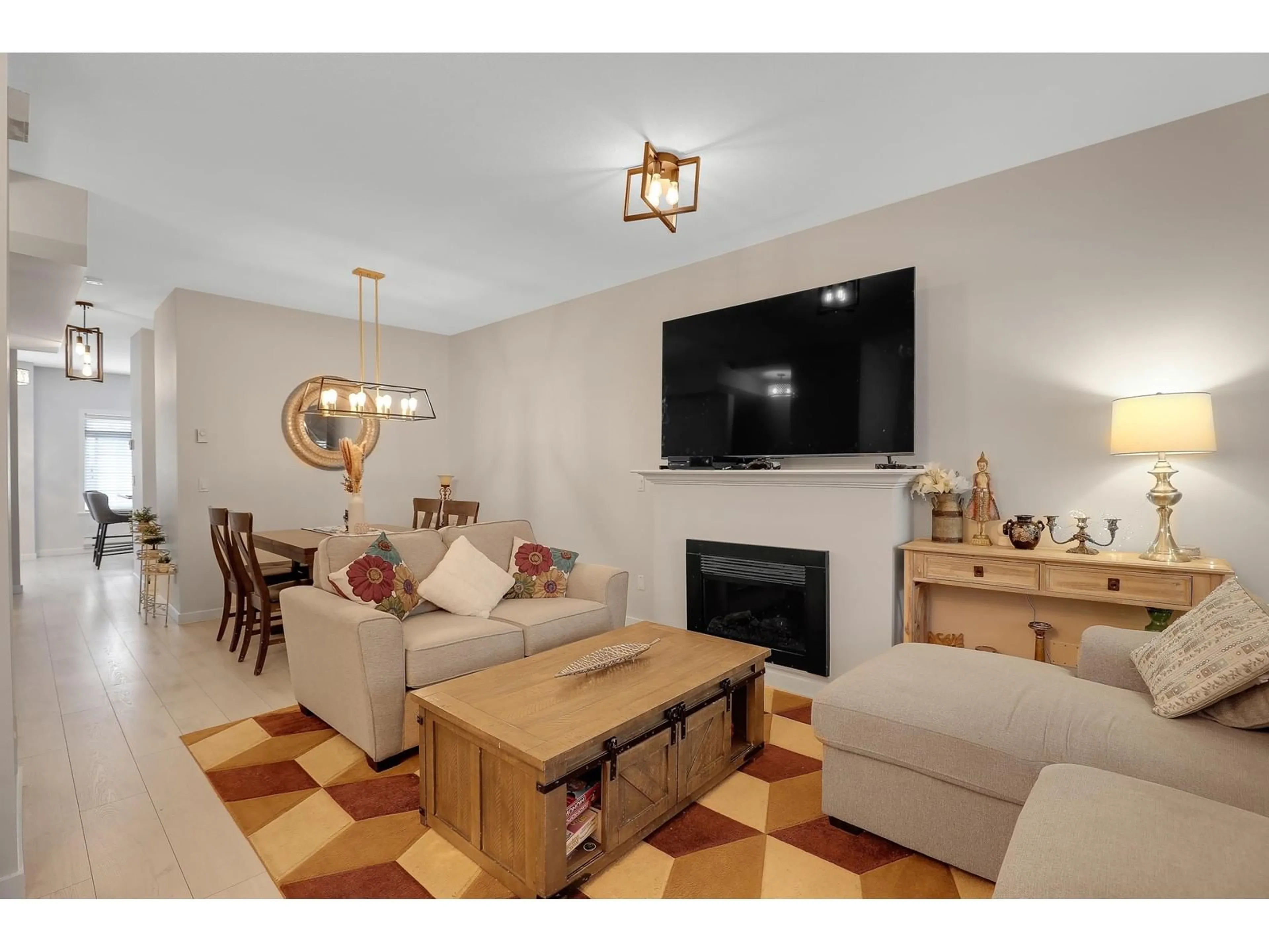 Living room with furniture, wood/laminate floor for 12 - 6852 193, Surrey British Columbia V4N0C8