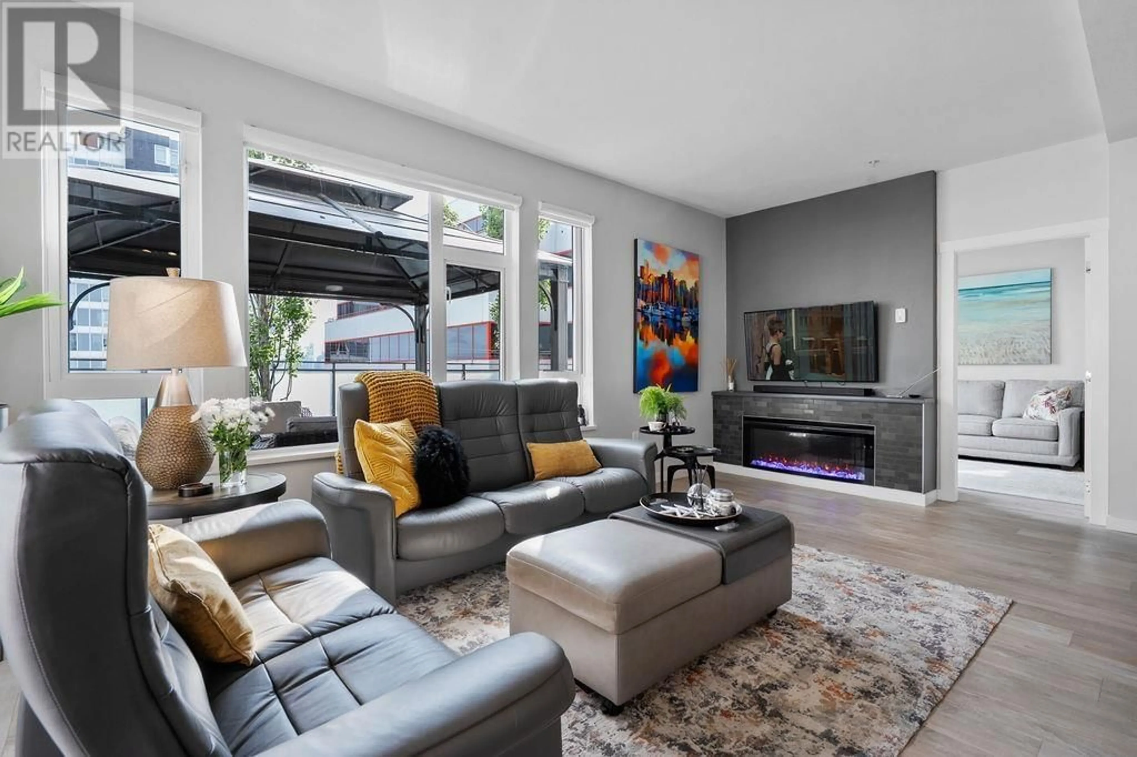 Living room with furniture, unknown for 212 - 123 1ST STREET, North Vancouver British Columbia V7M0E5