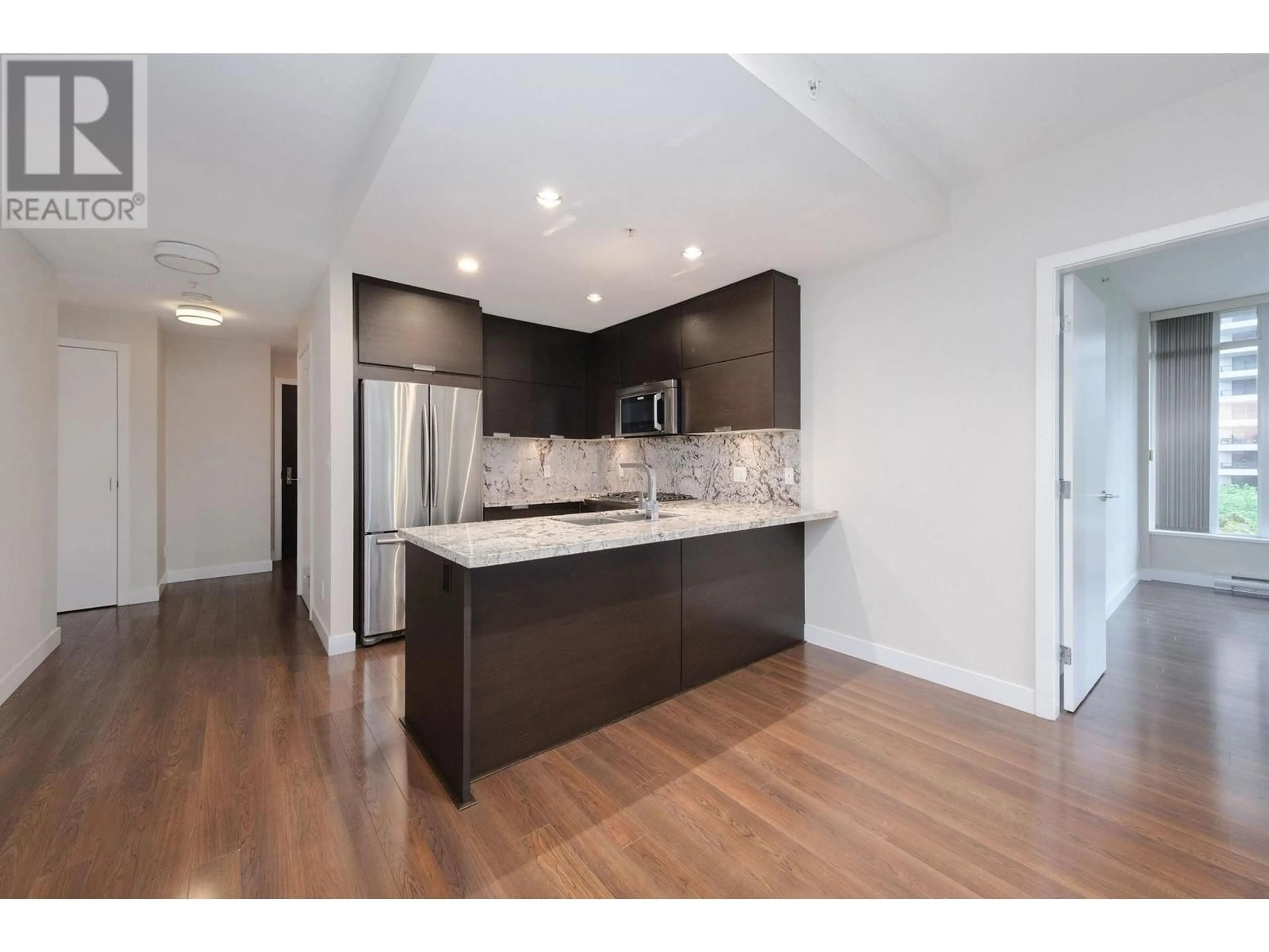 Open concept kitchen, wood/laminate floor for 207 - 2077 ROSSER AVENUE, Burnaby British Columbia V5C0G6