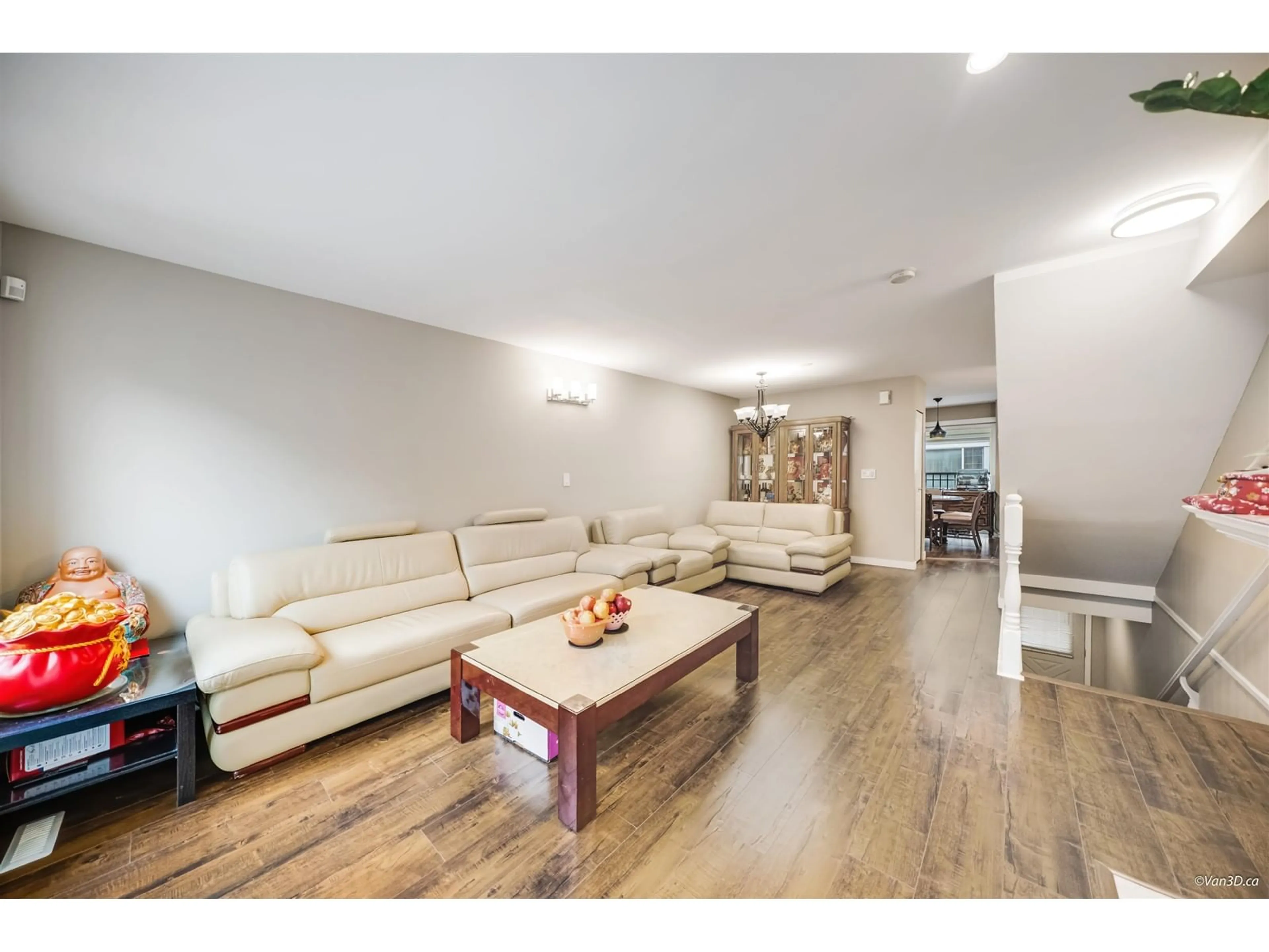 Living room with furniture, wood/laminate floor for 34 - 15488 101A, Surrey British Columbia V3R0Z8