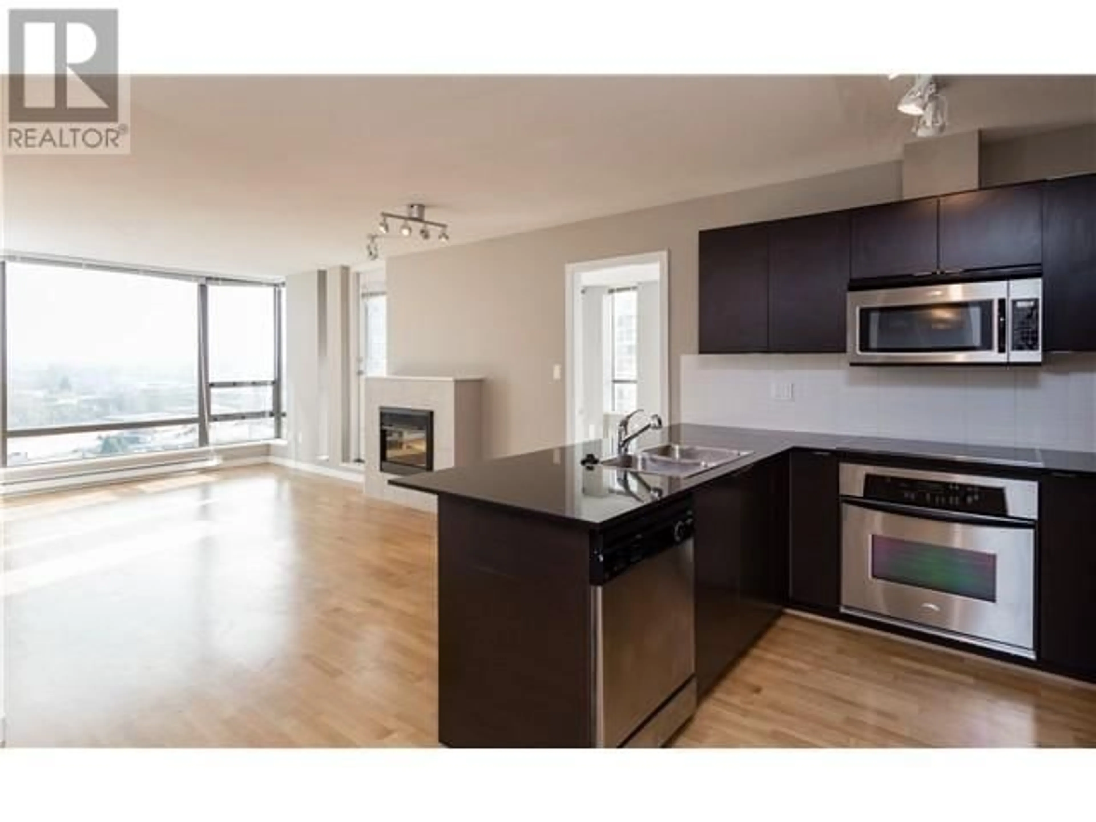 Open concept kitchen, wood/laminate floor for 1602 - 4182 DAWSON STREET, Burnaby British Columbia V5C0A2