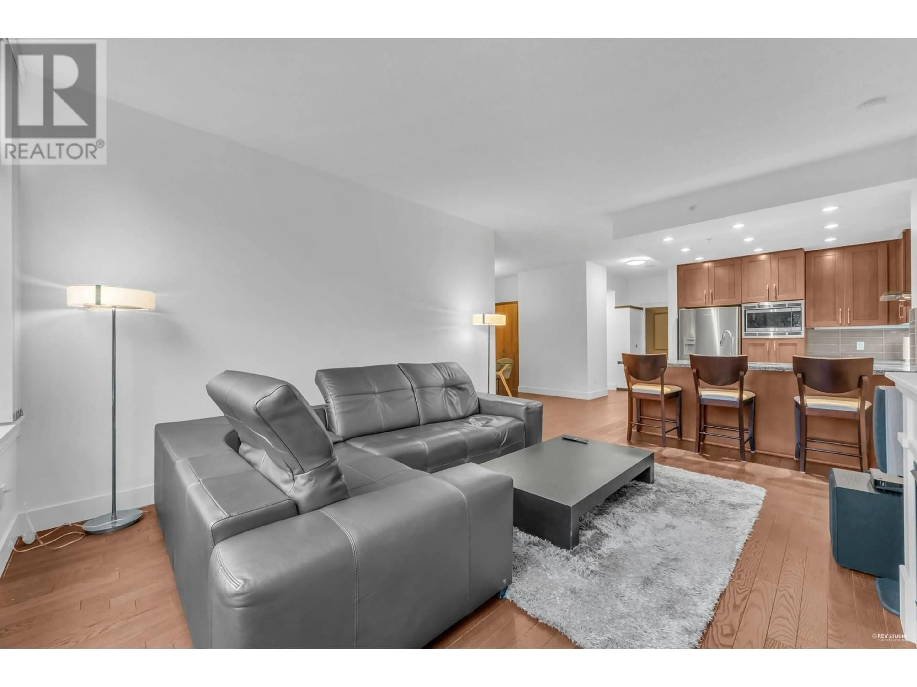 Living room with furniture, wood/laminate floor for 707 - 1415 PARKWAY BOULEVARD, Coquitlam British Columbia V3E0C7