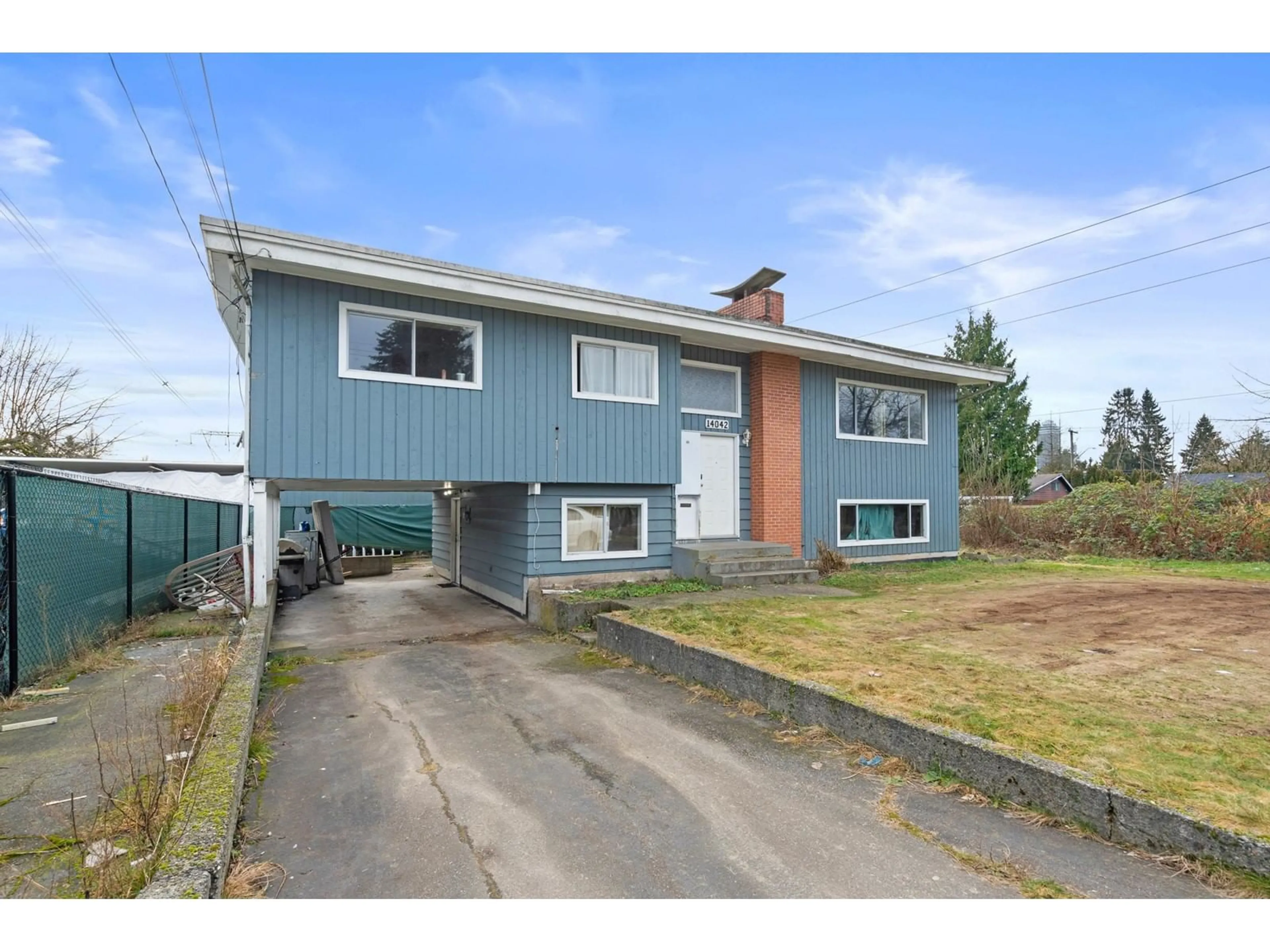 Home with vinyl exterior material, street for 14042 110, Surrey British Columbia V3R1Z2