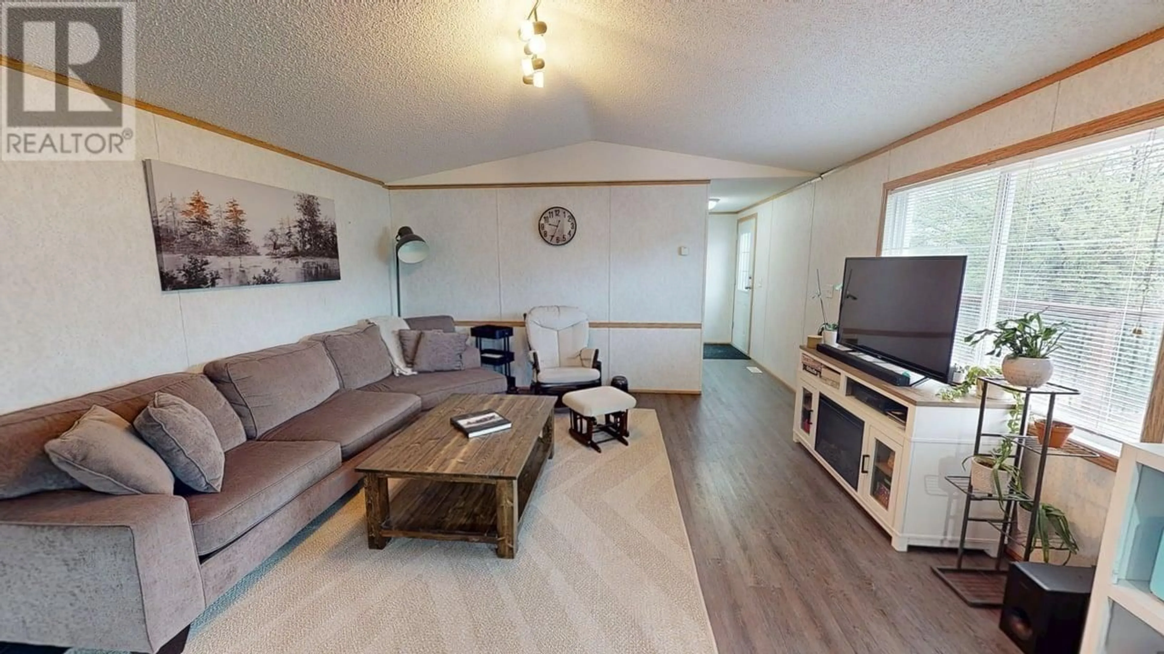 Living room with furniture, wood/laminate floor for 10479 98 STREET, Taylor British Columbia V0C2K0