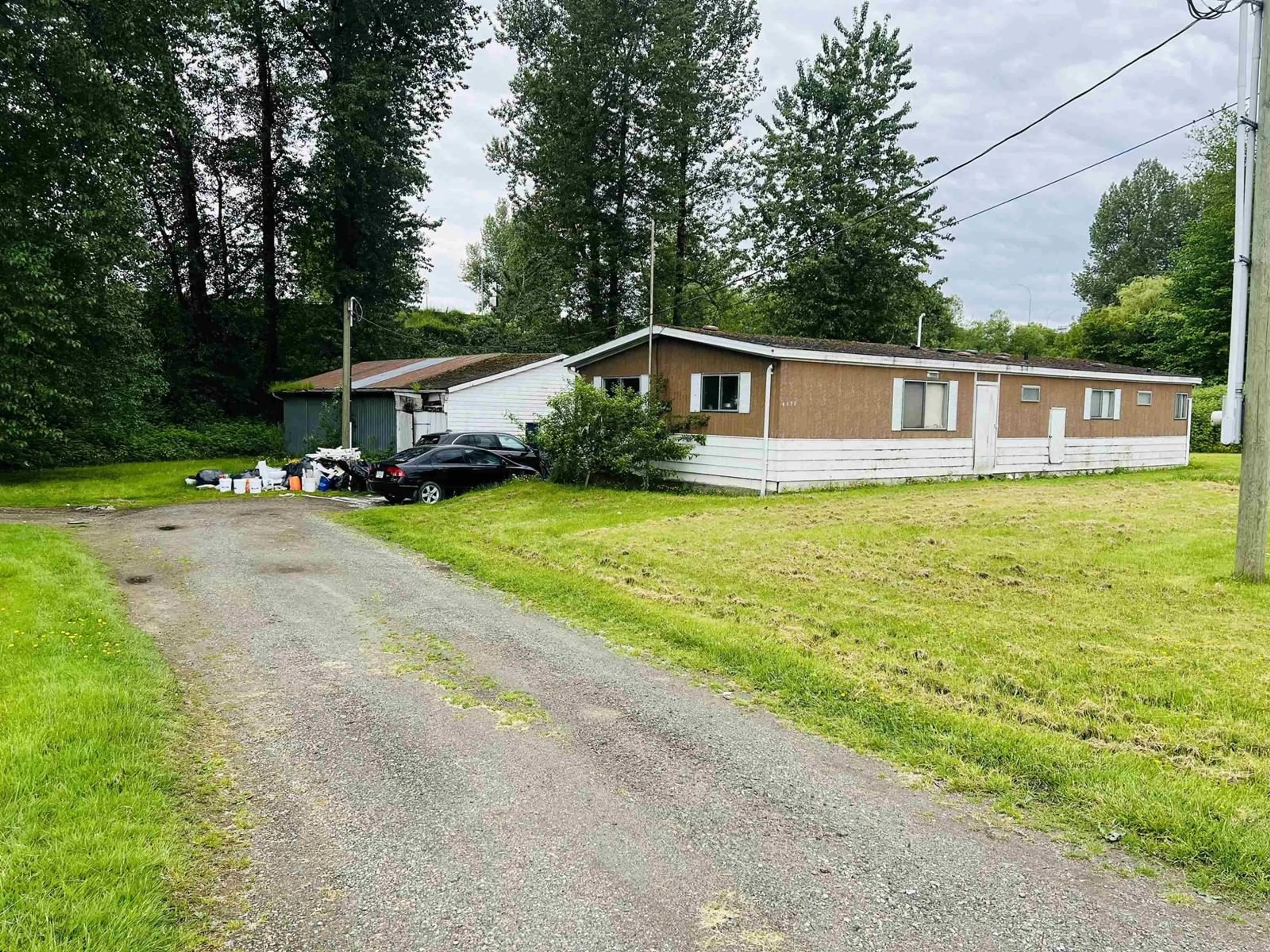 A pic from outside/outdoor area/front of a property/back of a property/a pic from drone, street for 6477 RIVERSIDE, Abbotsford British Columbia V4X1T9