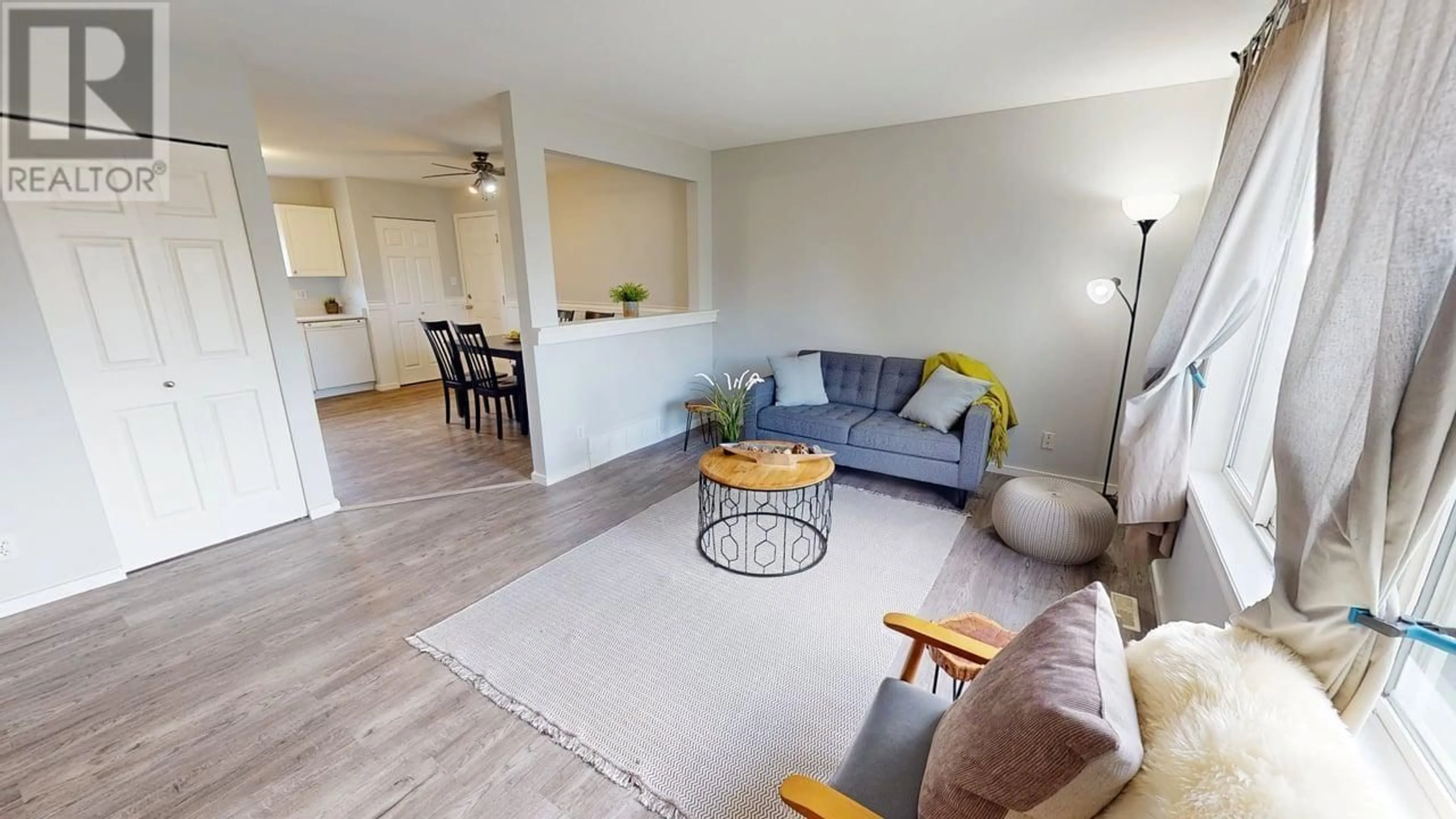 Living room with furniture, wood/laminate floor for 9607 93 STREET, Fort St. John British Columbia V1J5R9