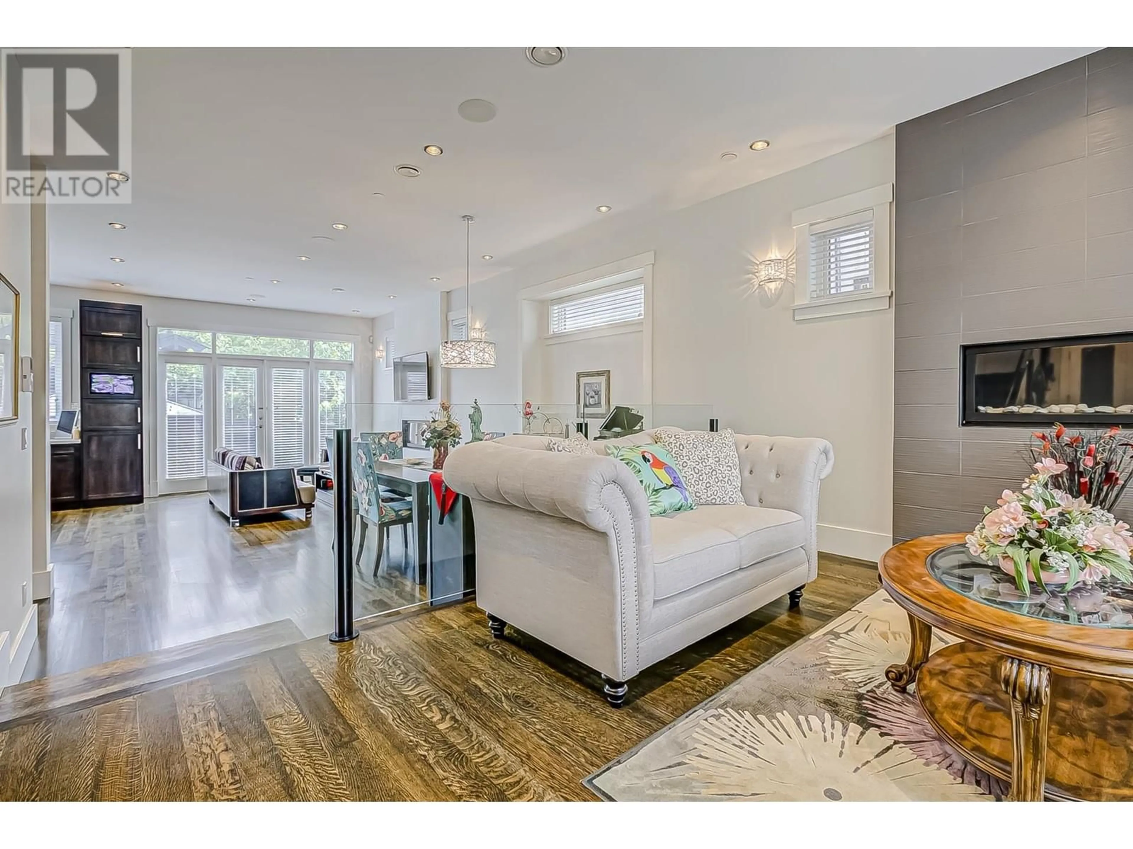 Living room with furniture, wood/laminate floor for 4478 15TH AVENUE, Vancouver British Columbia V6R3B2