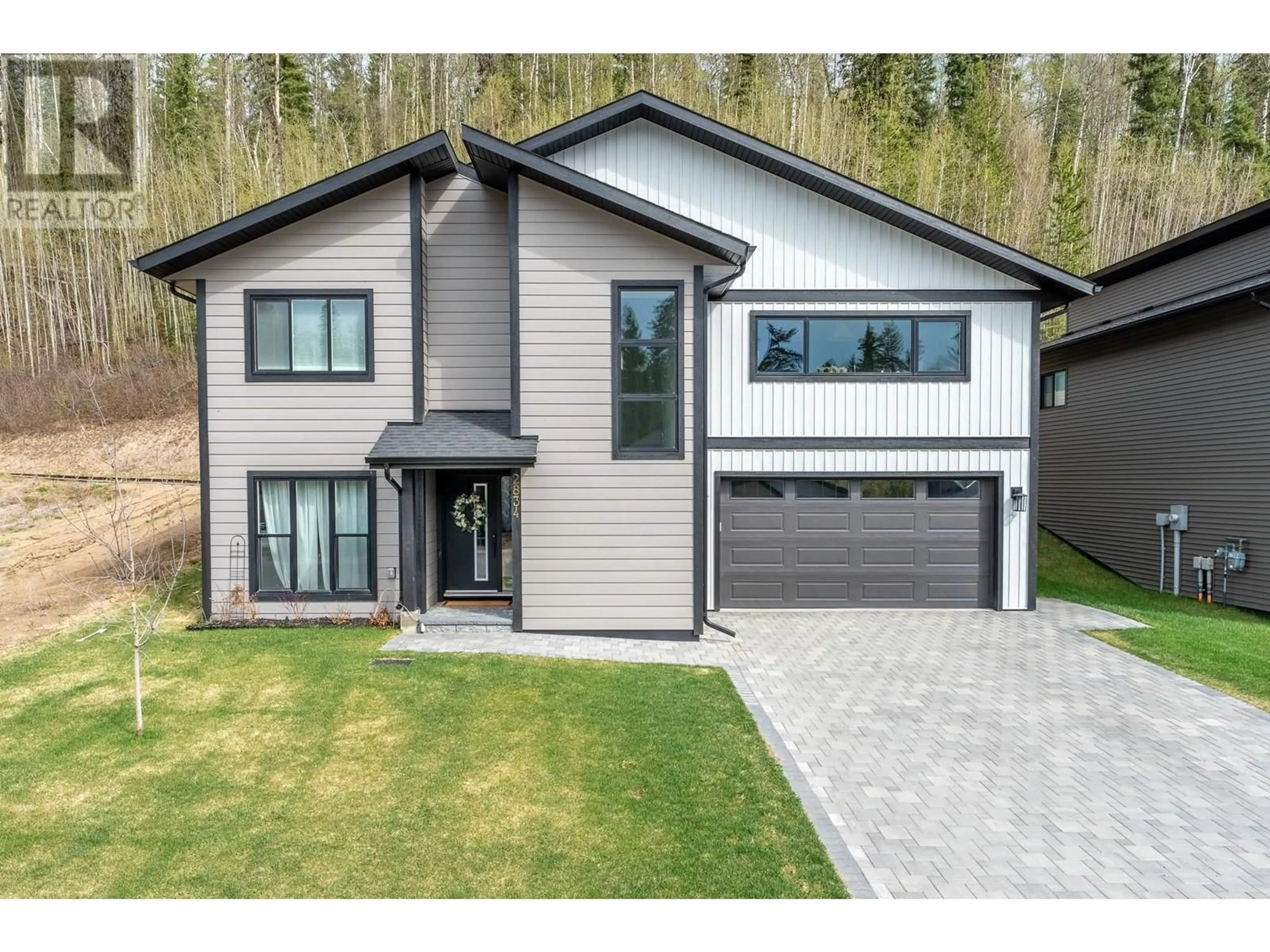 Home with brick exterior material, street for 2834 LINKS DRIVE, Prince George British Columbia V2K0B3