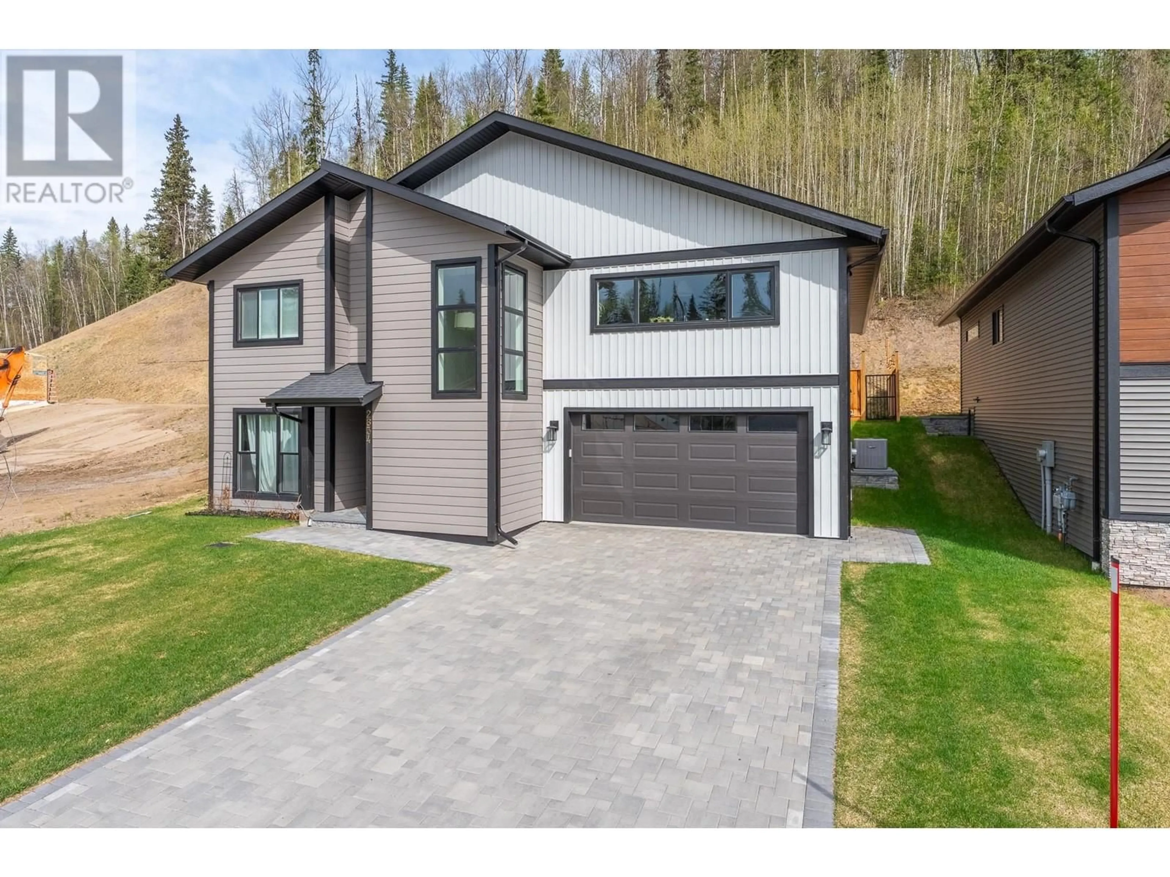 Home with brick exterior material, street for 2834 LINKS DRIVE, Prince George British Columbia V2K0B3