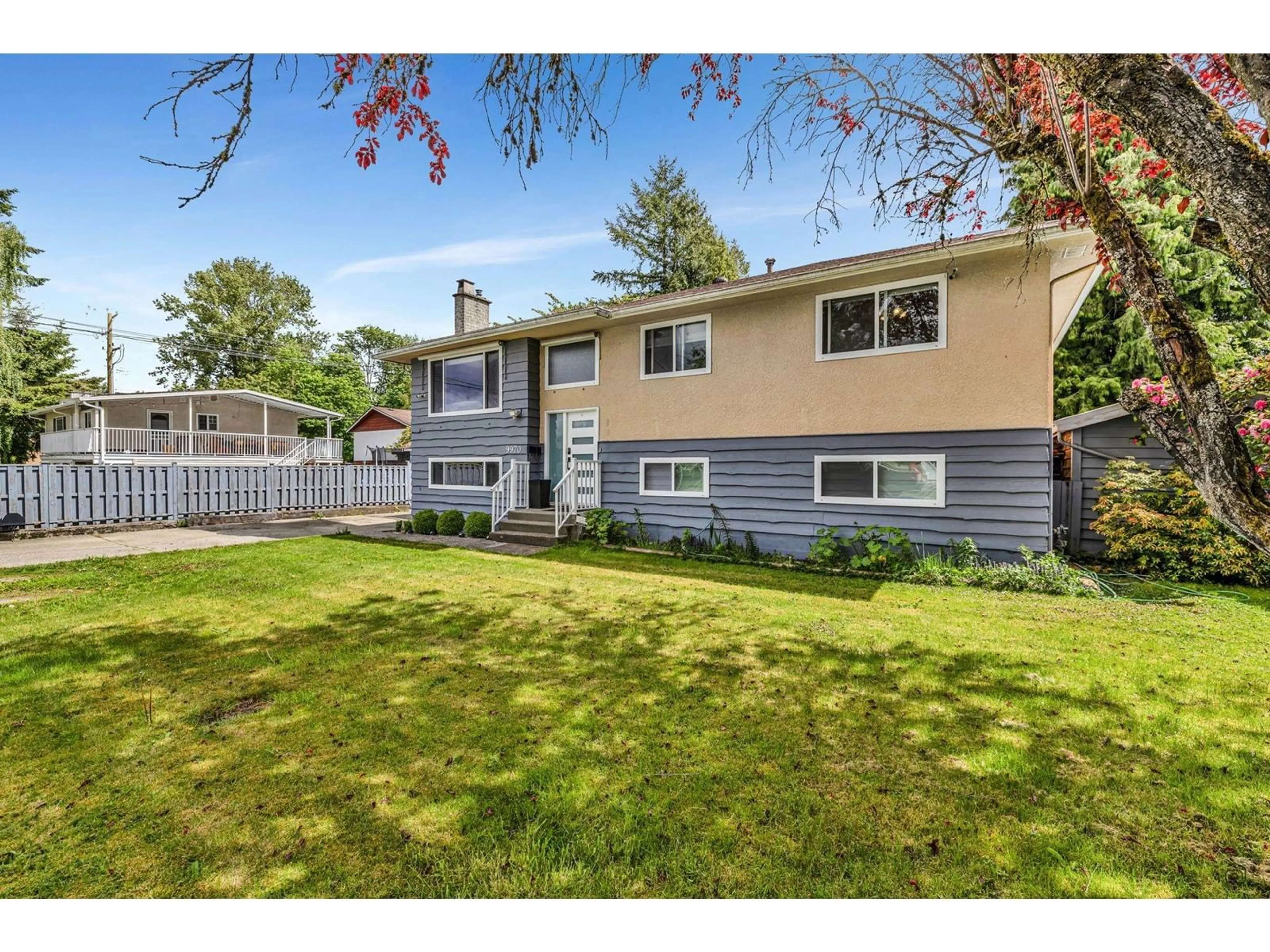 Home with vinyl exterior material, street for 9970 124A, Surrey British Columbia V3V3W5