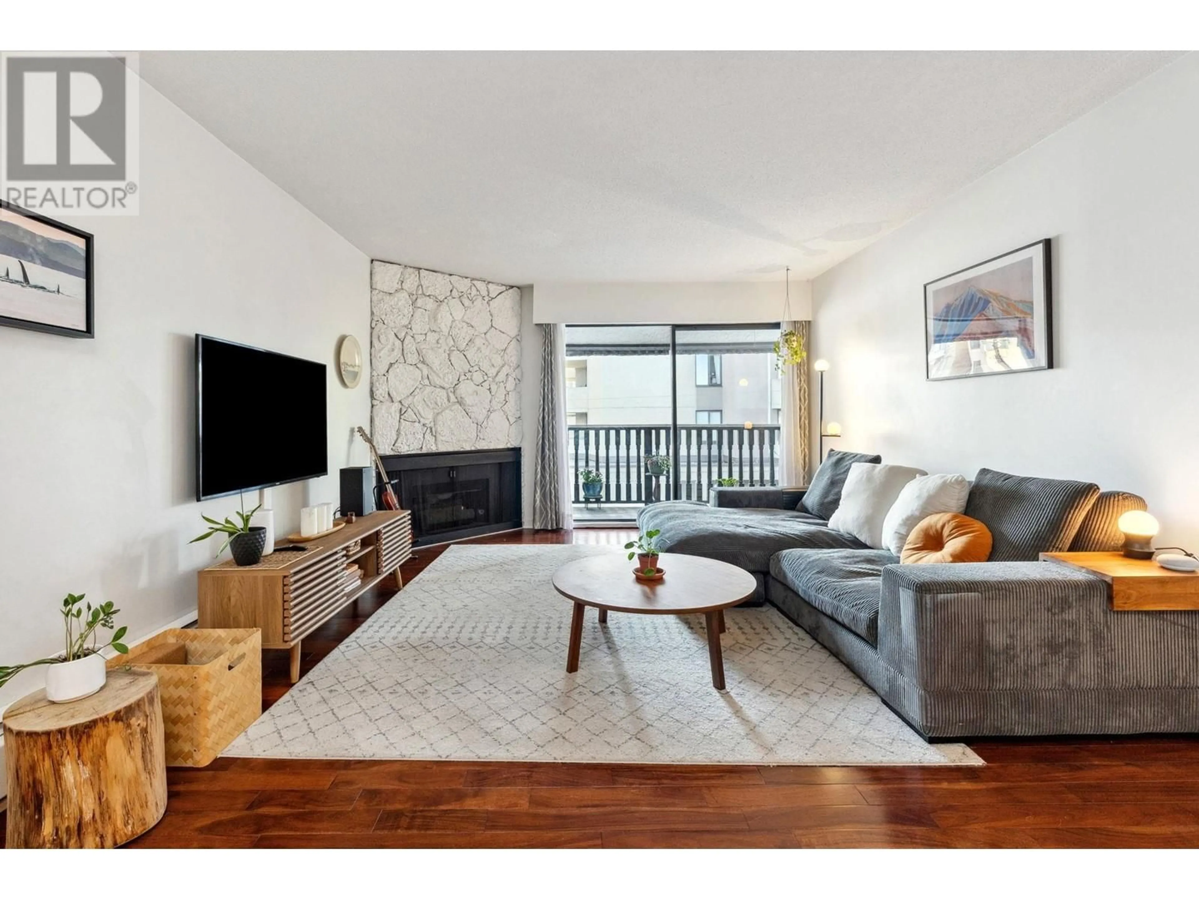 Living room with furniture, wood/laminate floor for 301 - 1610 CHESTERFIELD AVENUE, North Vancouver British Columbia V7M2N7
