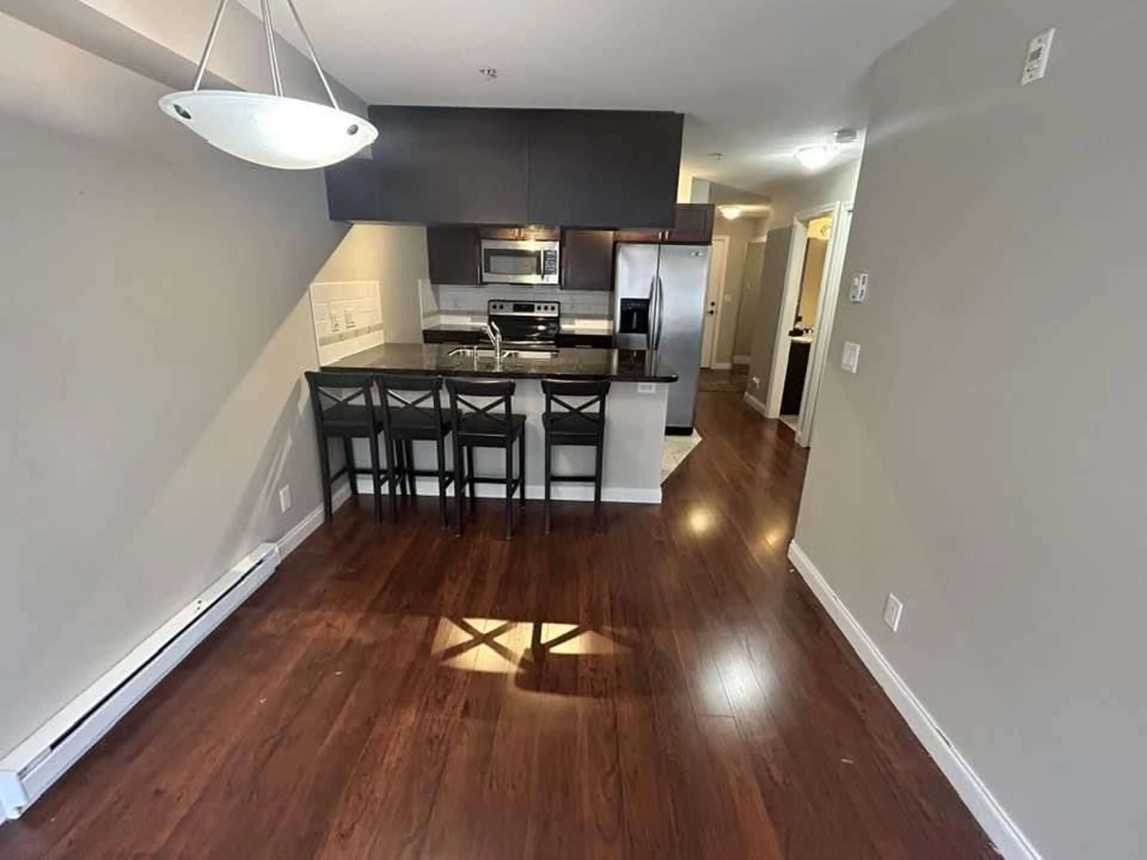 Open concept kitchen, wood/laminate floor for 241 - 5660 201A, Surrey British Columbia V3A0B4