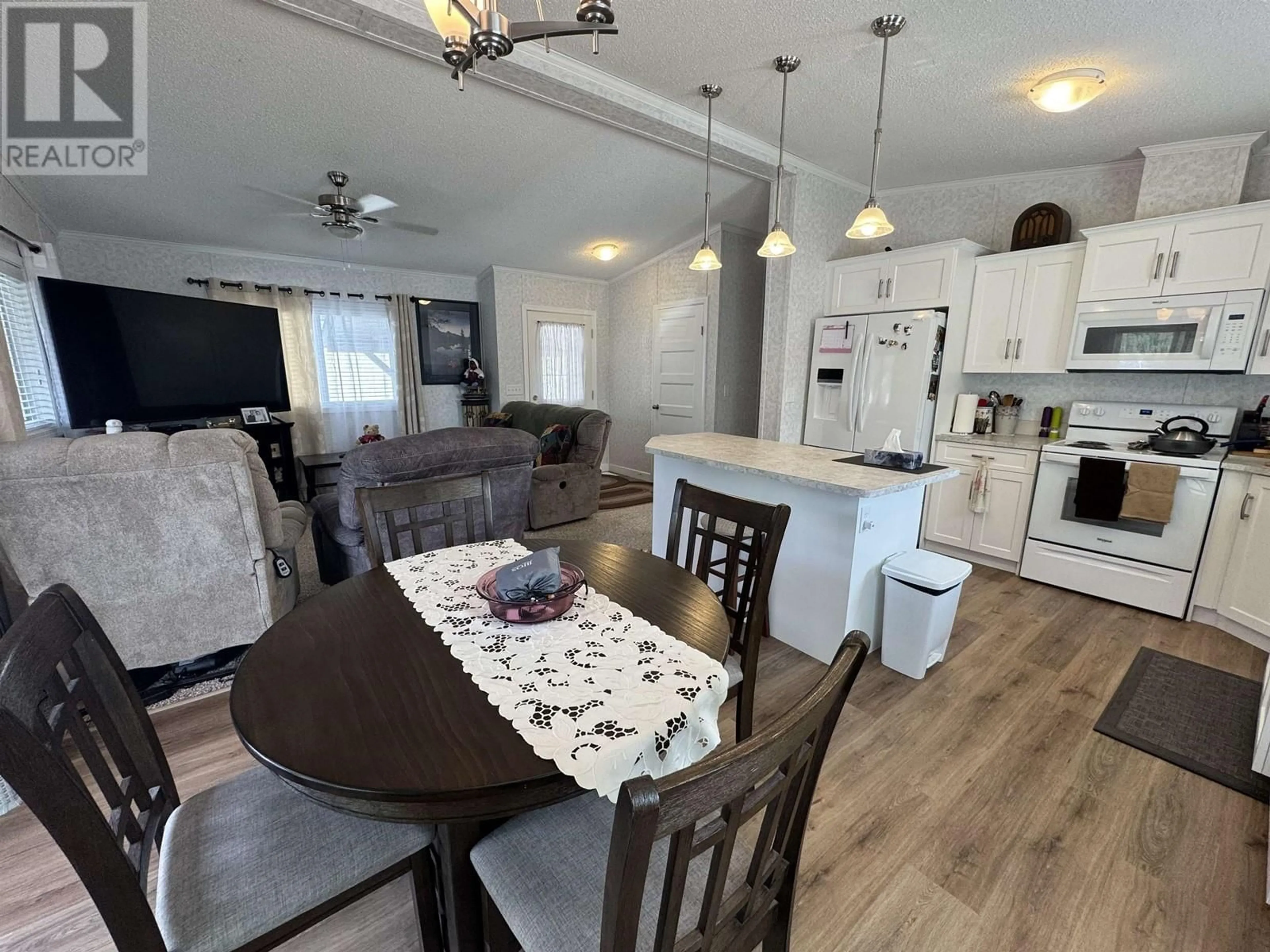 Open concept kitchen, wood/laminate floor for 56 - 3001 MACKENZIE AVENUE, Williams Lake British Columbia V2G3N9