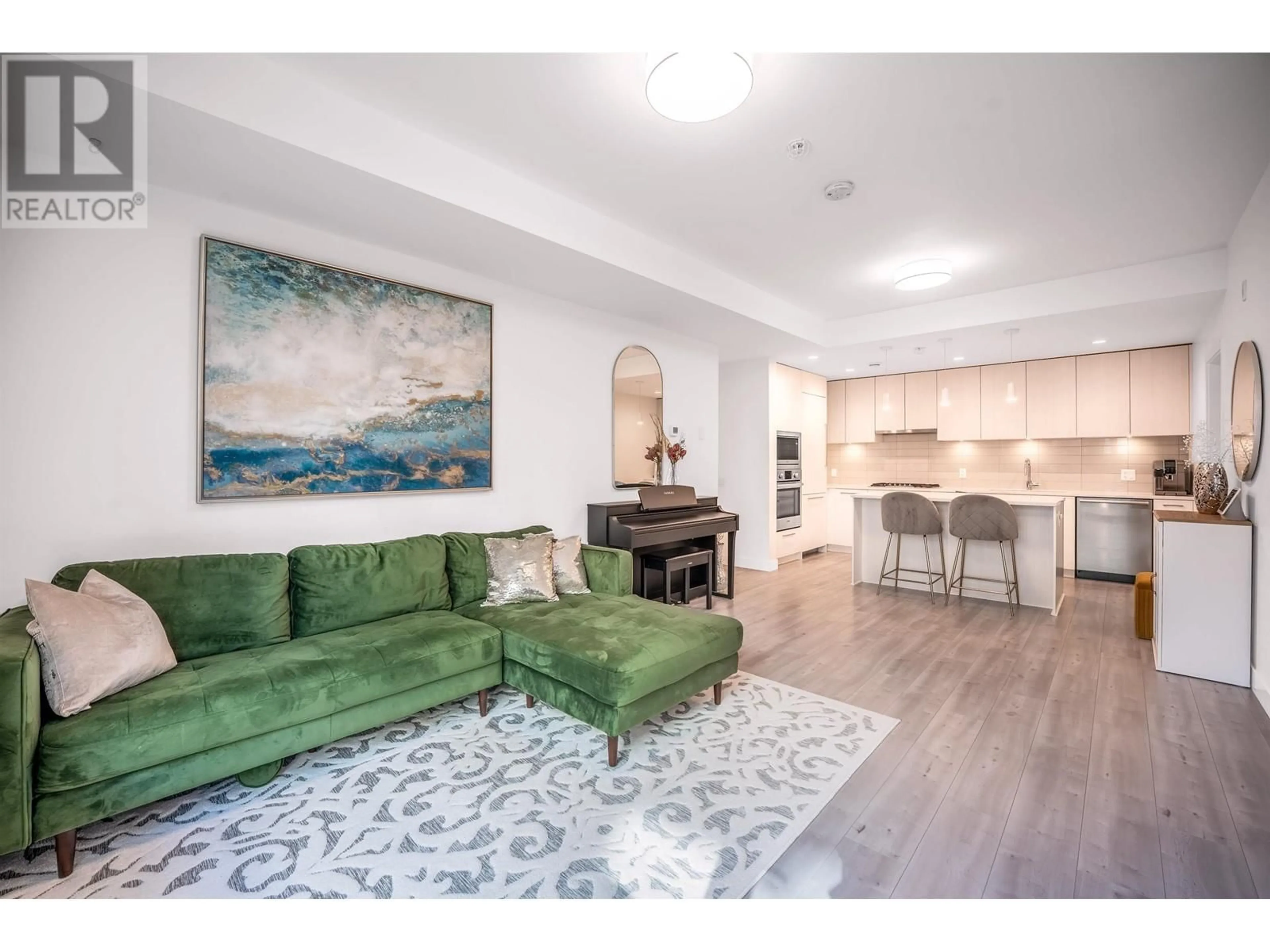 Living room with furniture, wood/laminate floor for 136 - 2035 GLENAIRE DRIVE, North Vancouver British Columbia V7P1Y2