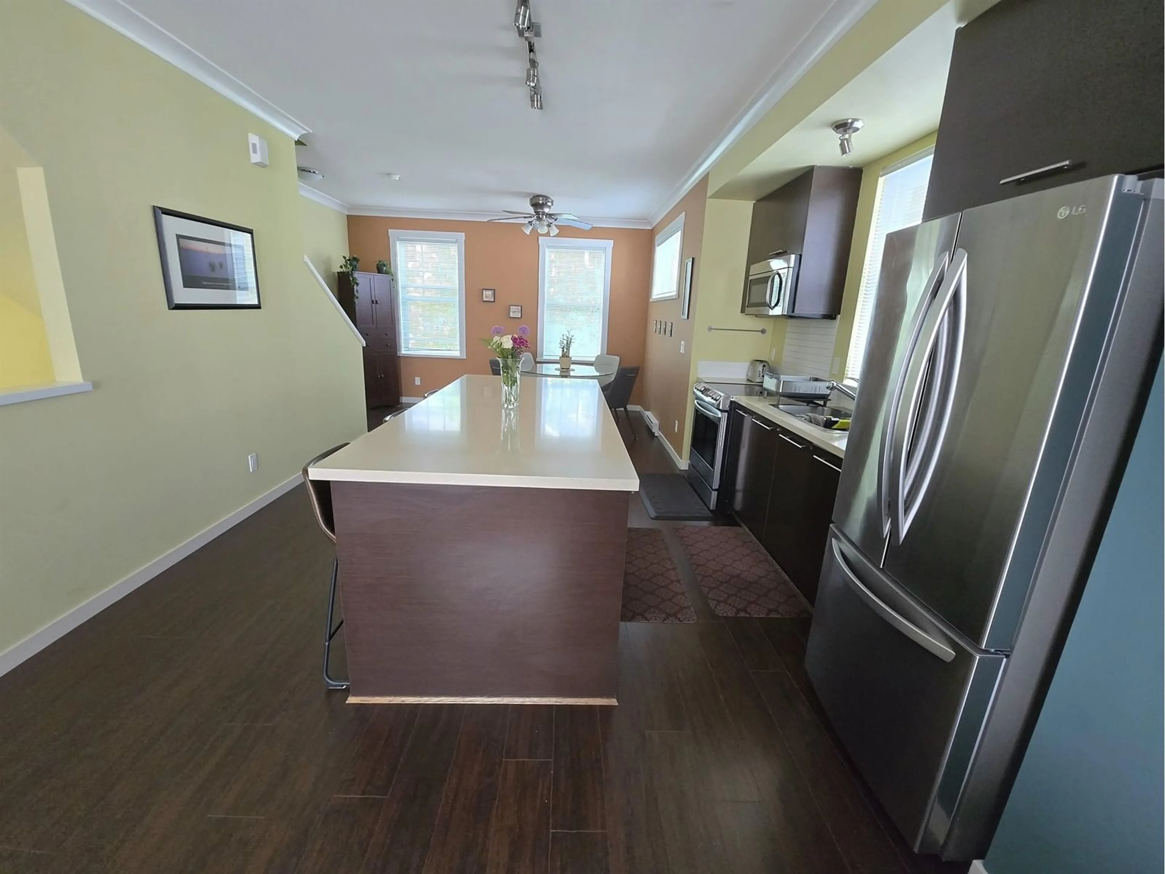 Open concept kitchen, wood/laminate floor for 61 - 18983 72A, Surrey British Columbia V4N1A5