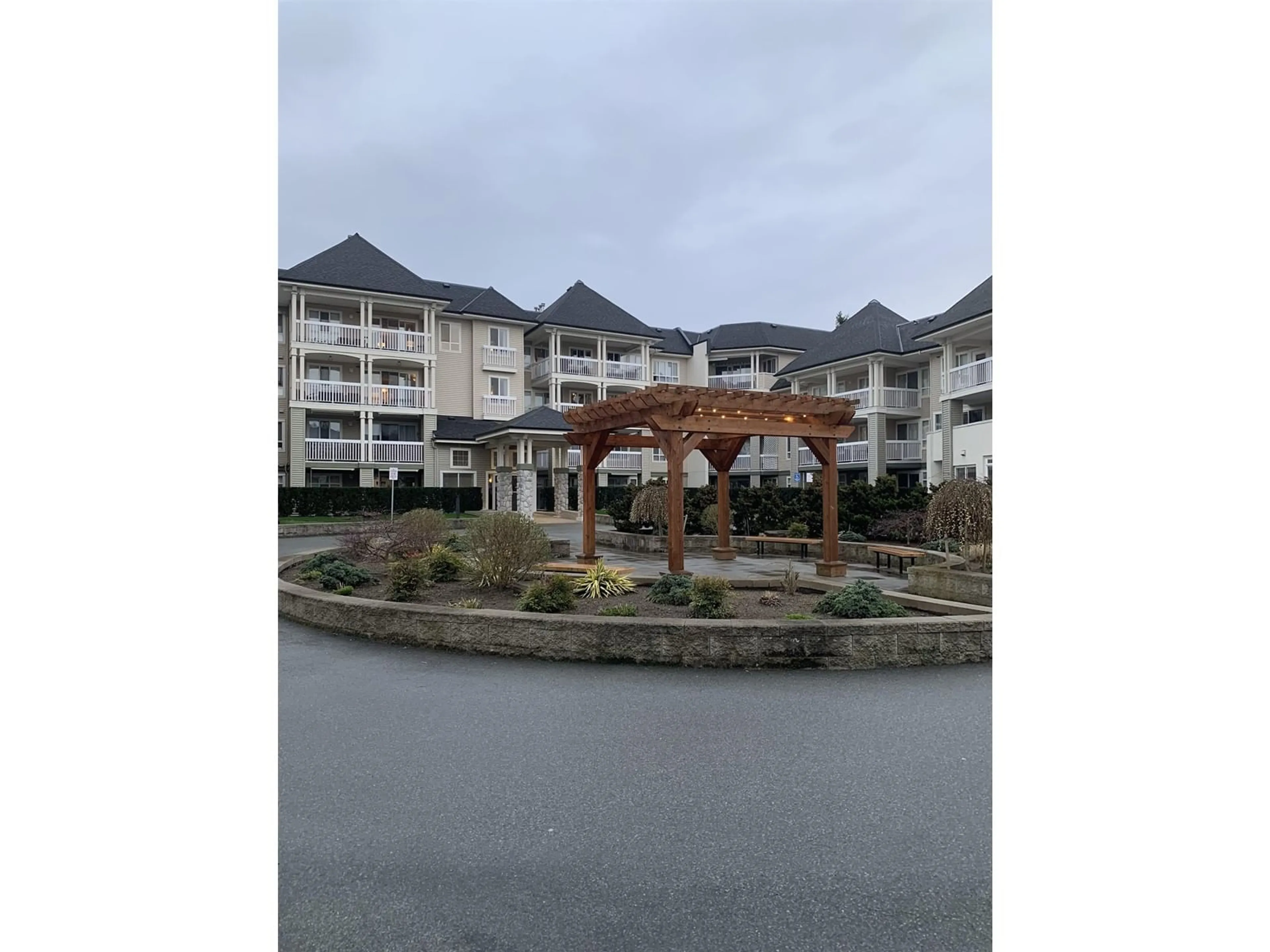A pic from outside/outdoor area/front of a property/back of a property/a pic from drone, mountain view for 210 - 22022 49, Langley British Columbia V3A3R9