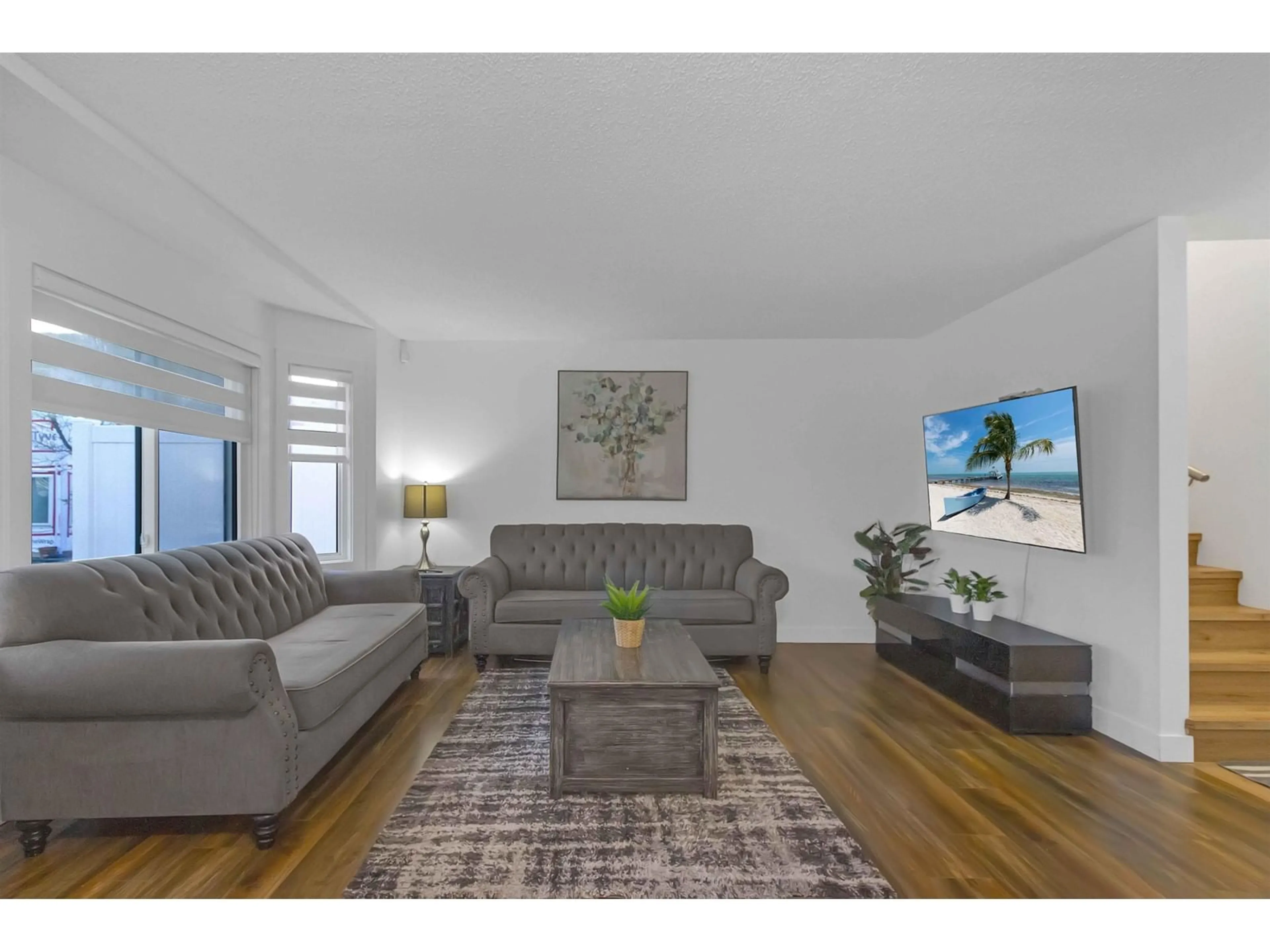 Living room with furniture, wood/laminate floor for 138 - 7321 140, Surrey British Columbia V3W5J6