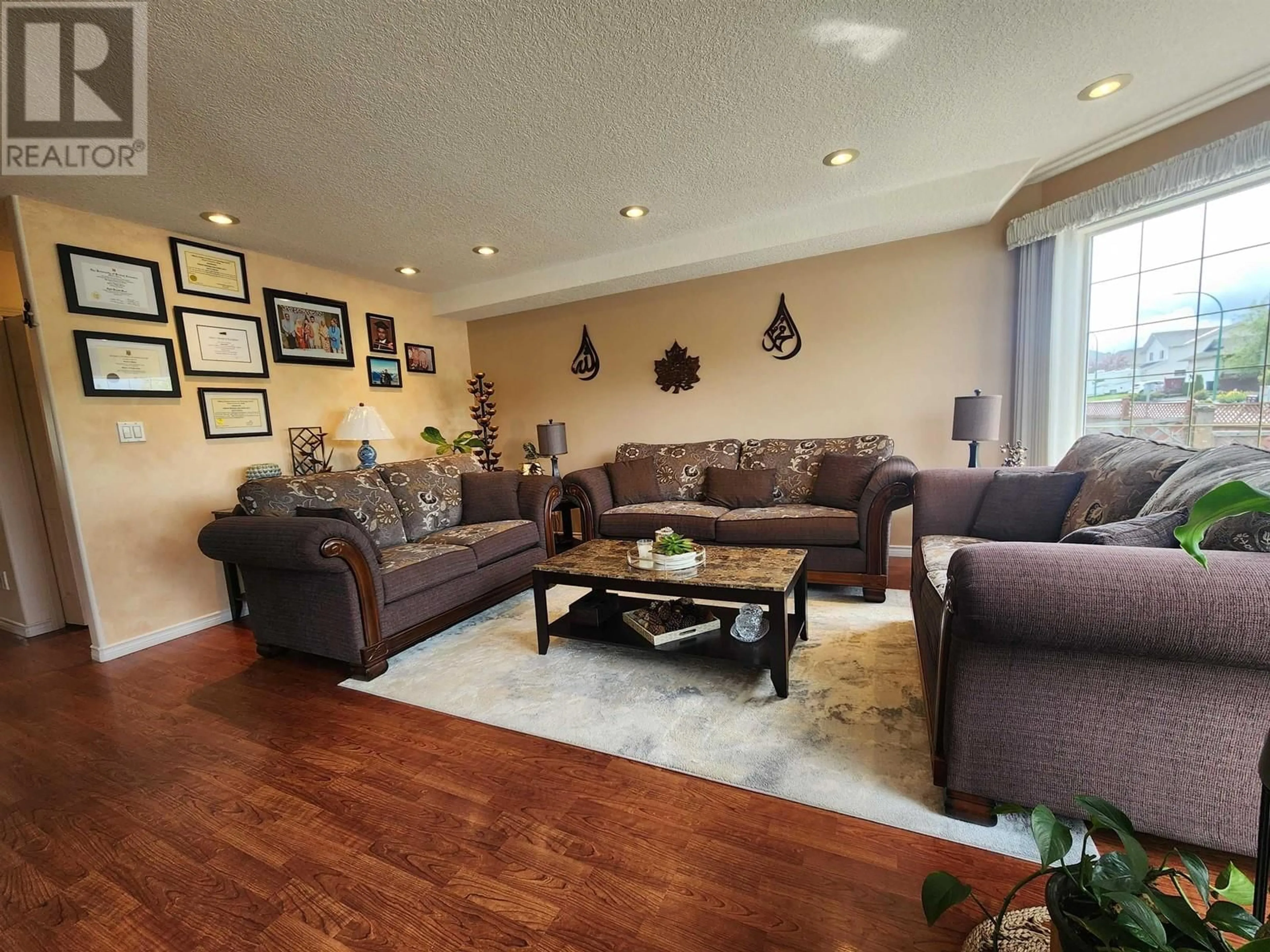 Living room with furniture, wood/laminate floor for 6808 WESTGATE AVENUE, Prince George British Columbia V2N5R2