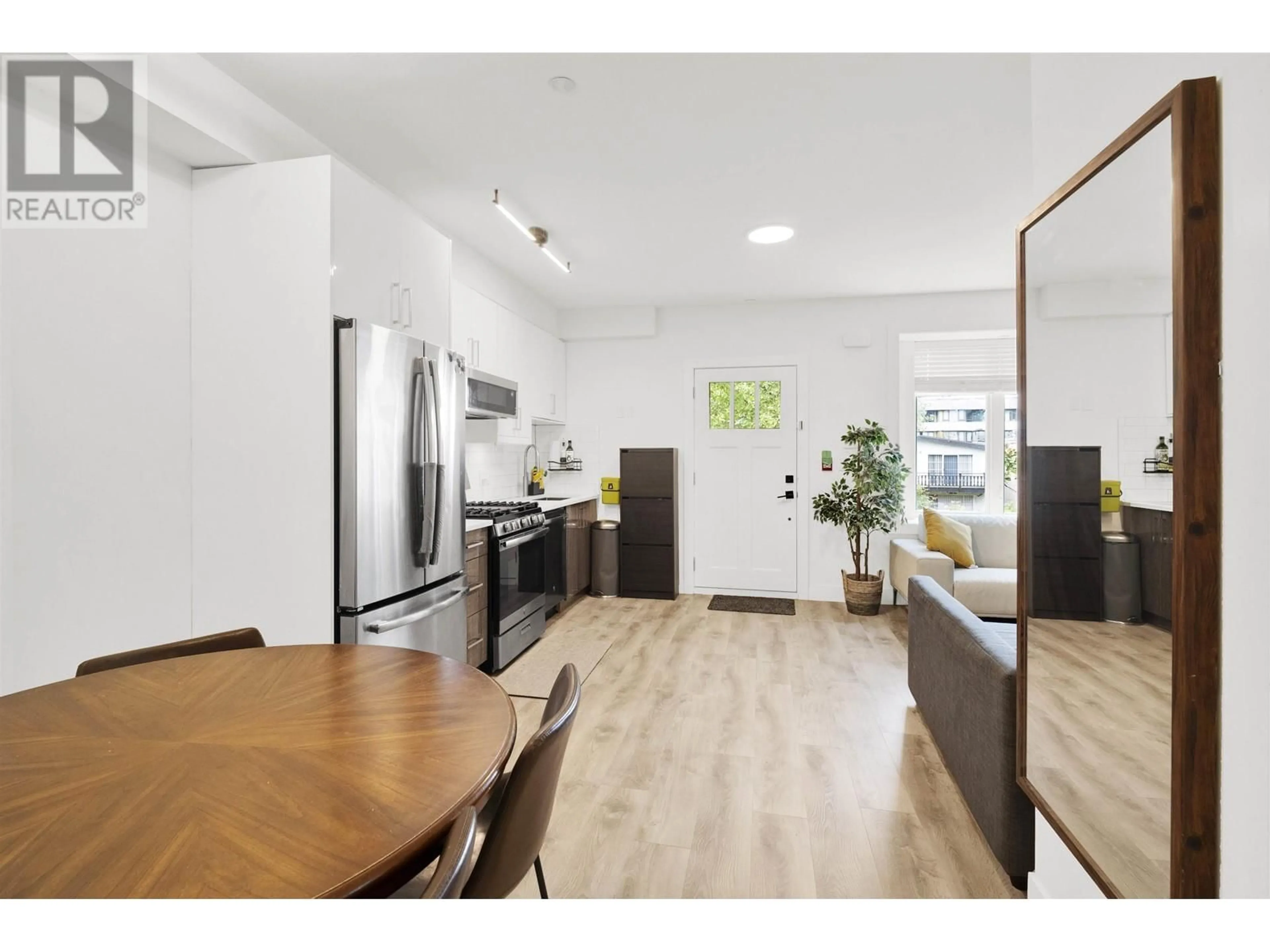 Open concept kitchen, wood/laminate floor for 2743 DUKE STREET, Vancouver British Columbia V5R4S8