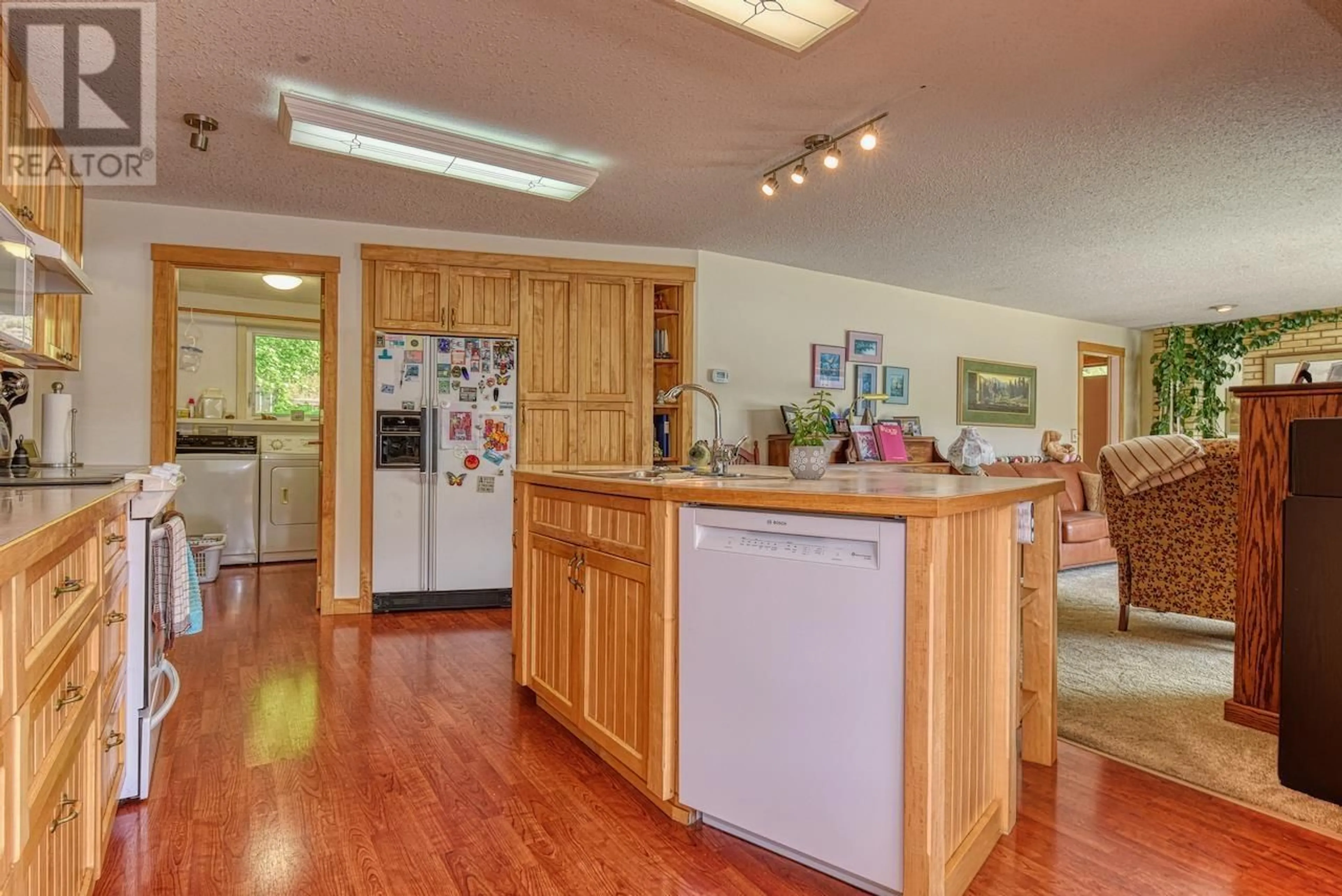 Open concept kitchen, wood/laminate floor for 111 FOWLER ROAD, Williams Lake British Columbia V2G5G7