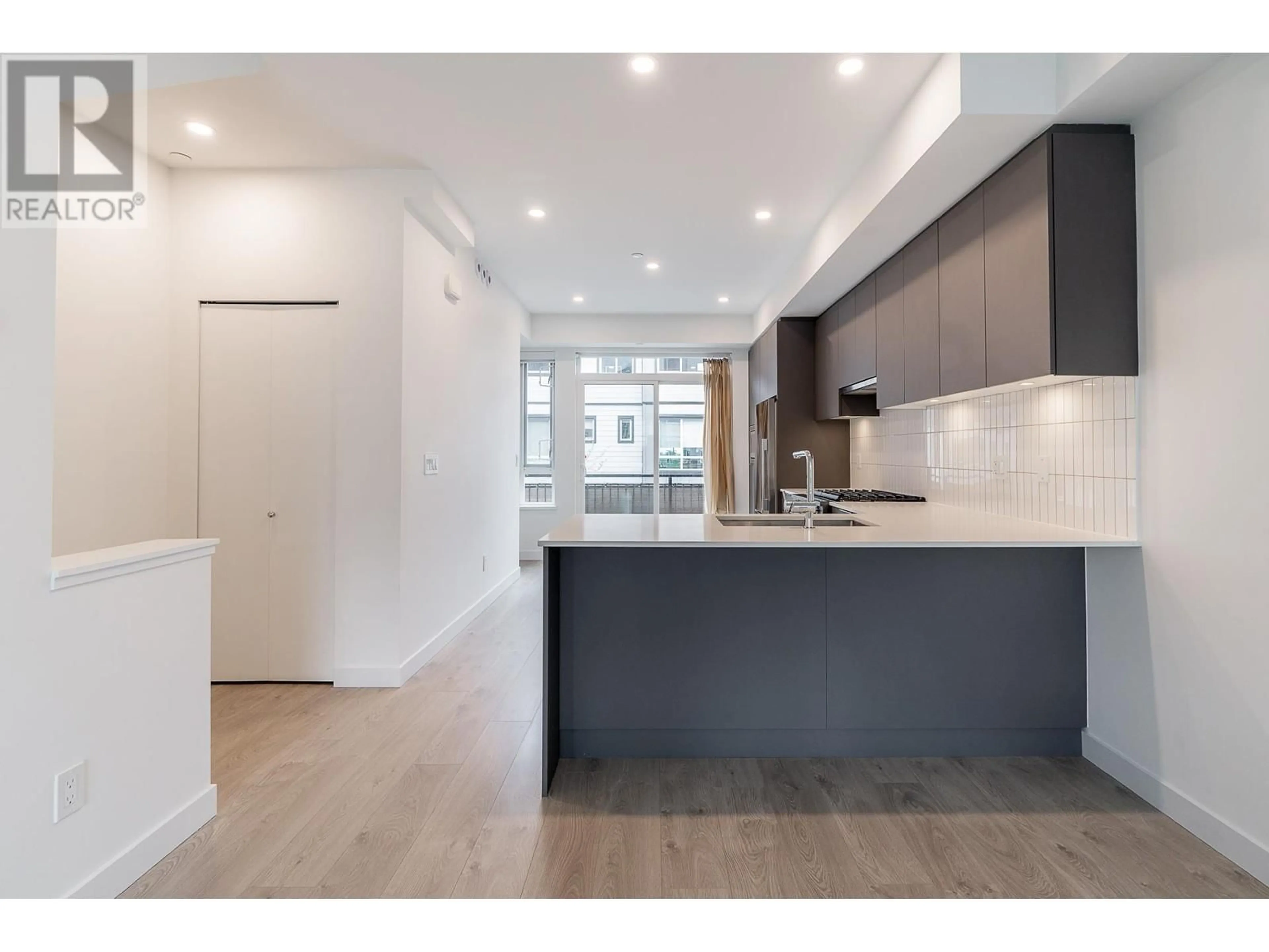 Open concept kitchen, wood/laminate floor for 19 - 4408 CORMORANT WAY, Tsawwassen British Columbia V4M0E9