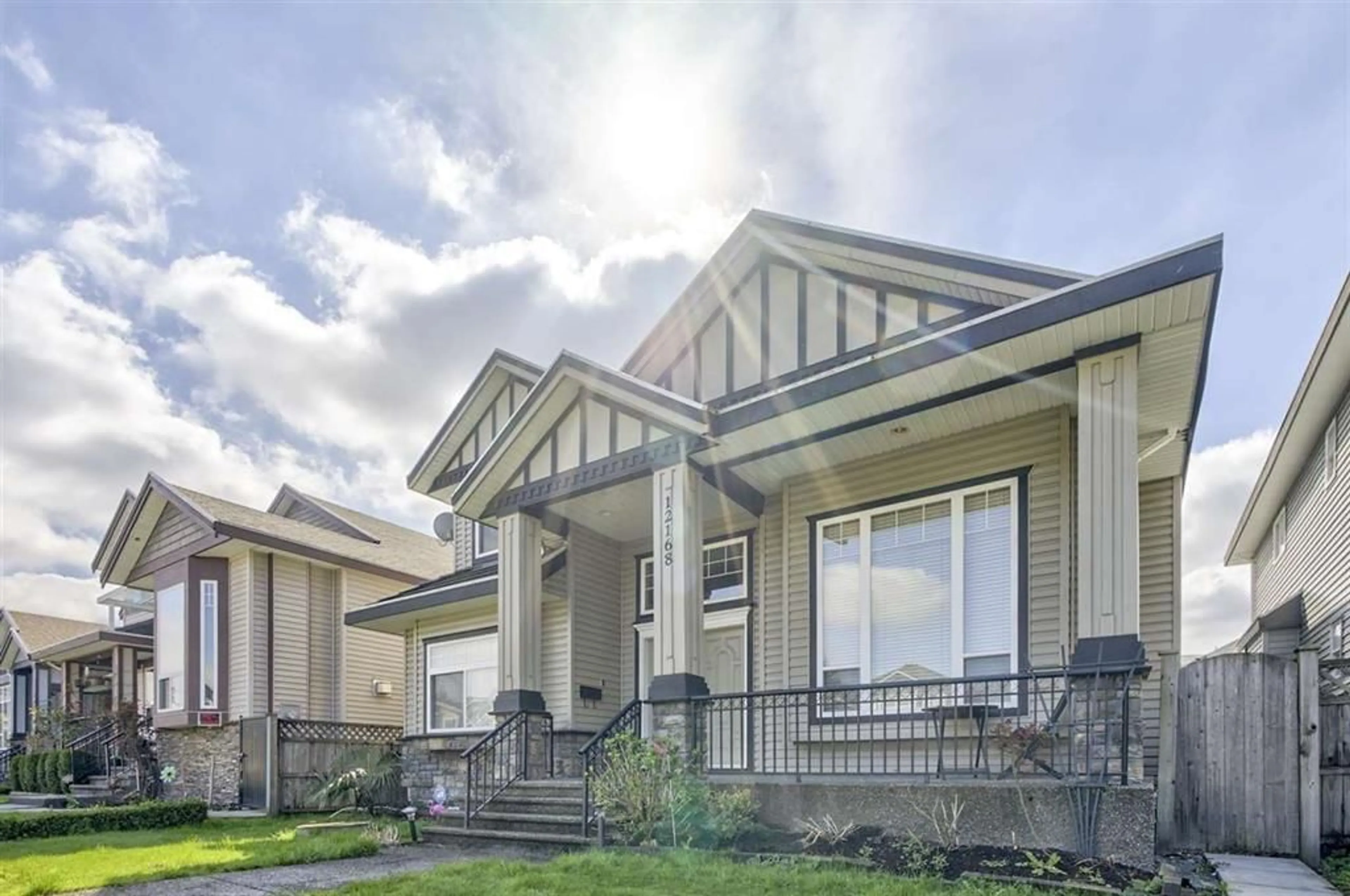Home with vinyl exterior material, street for 12168 96A, Surrey British Columbia V3V7C3