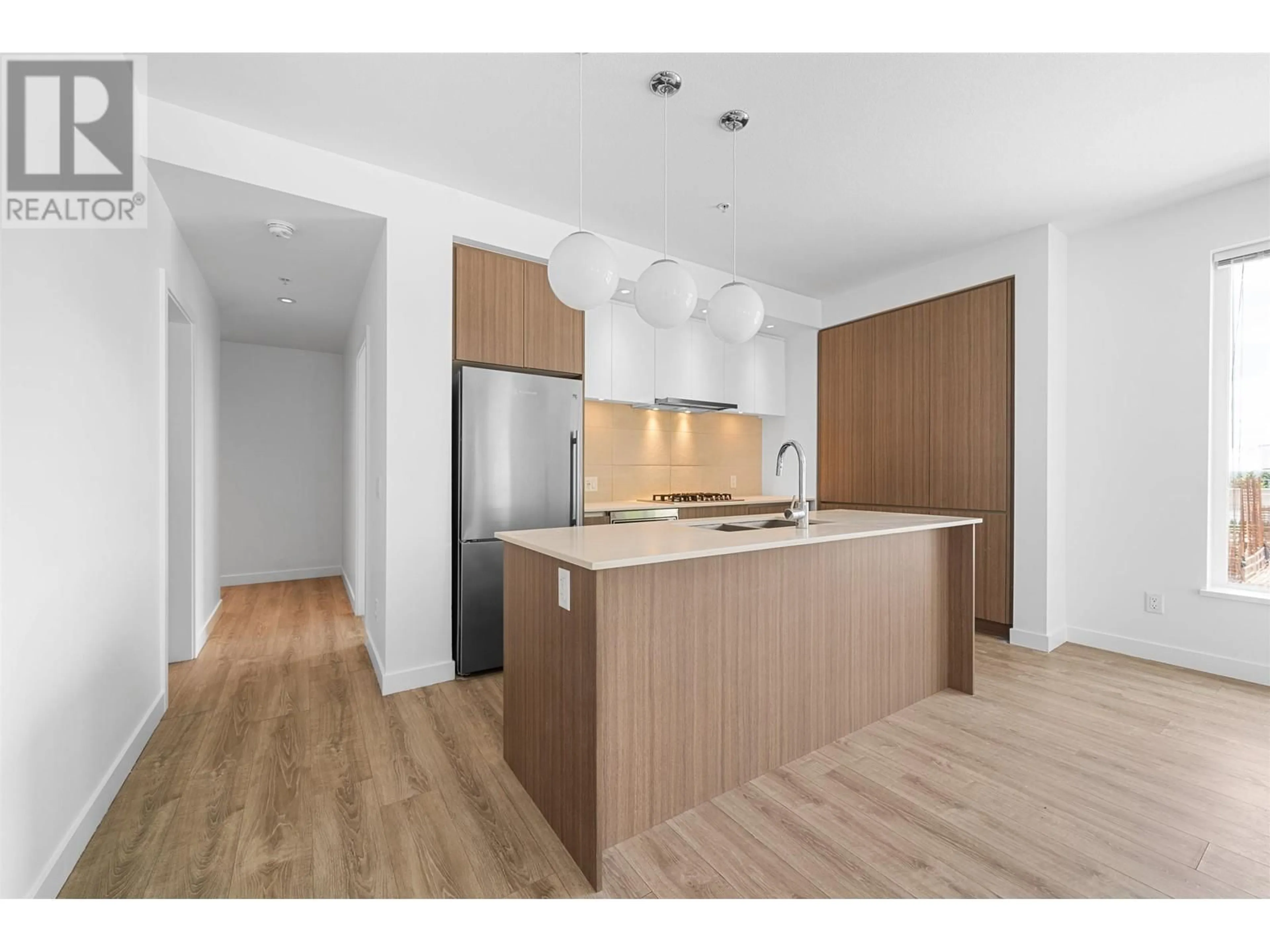Open concept kitchen, wood/laminate floor for 209 - 516 FOSTER AVENUE, Coquitlam British Columbia V3J0H8