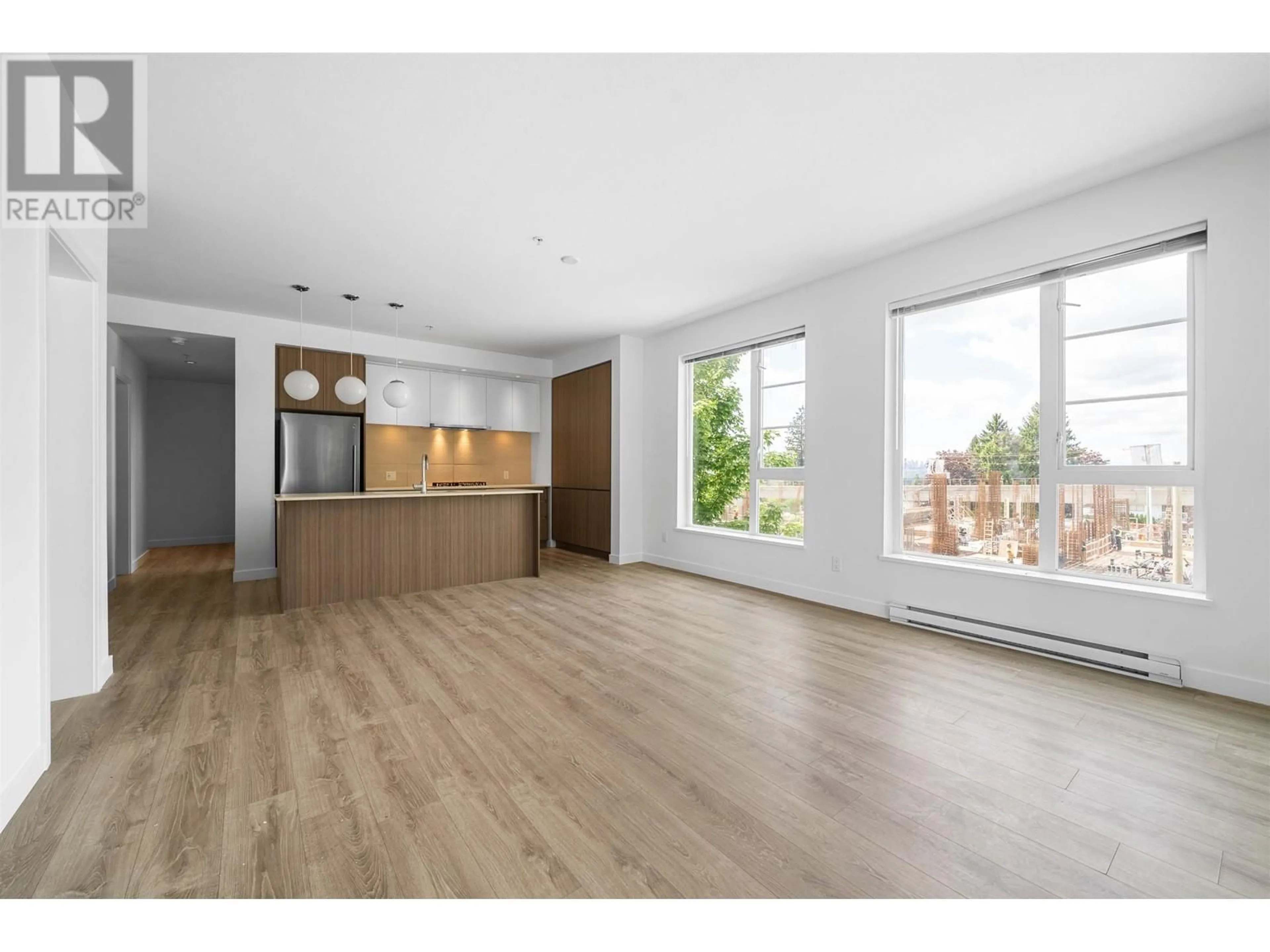 Open concept kitchen, wood/laminate floor for 209 - 516 FOSTER AVENUE, Coquitlam British Columbia V3J0H8