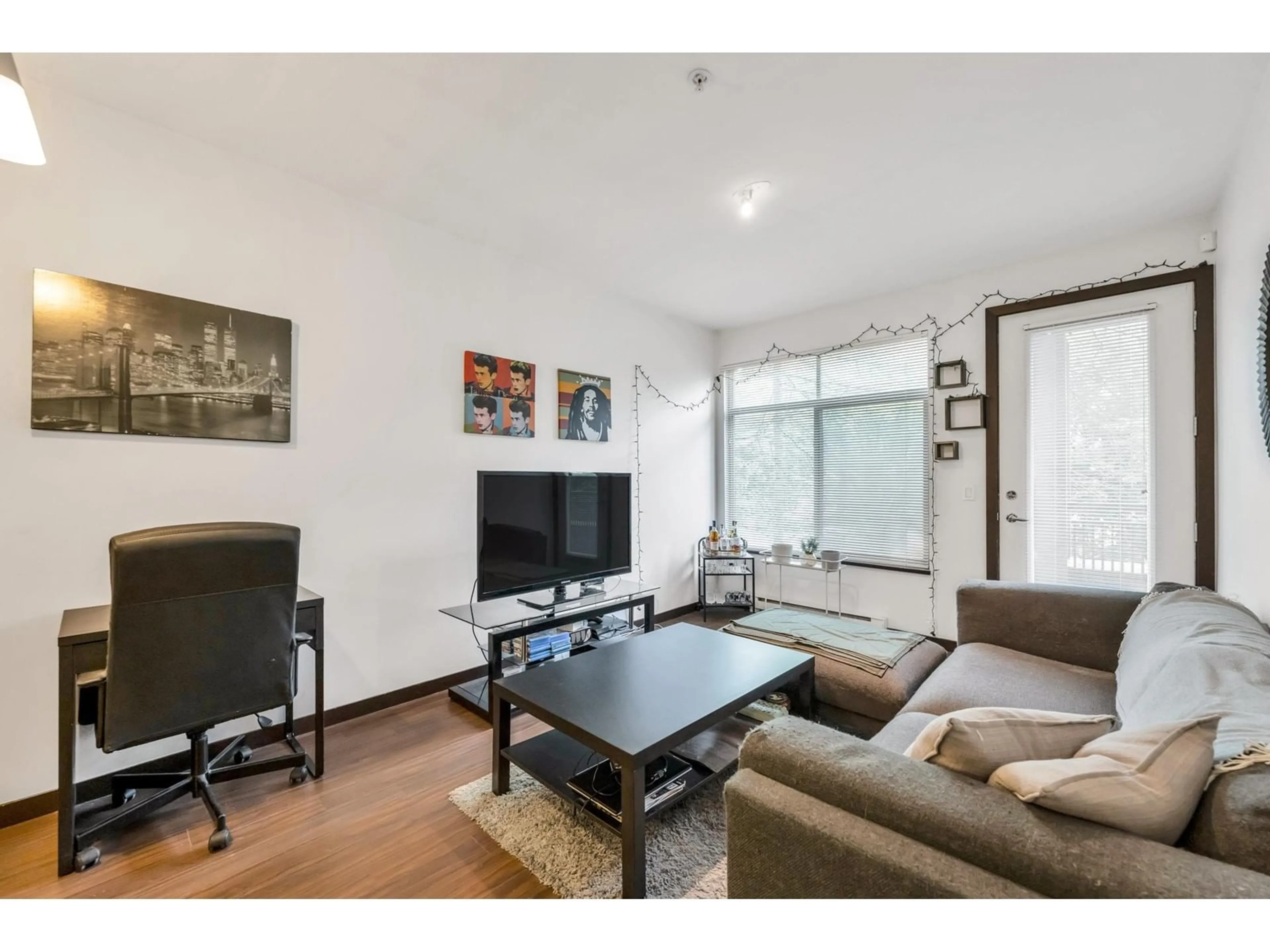Living room with furniture, wood/laminate floor for 210 - 10499 UNIVERSITY, Surrey British Columbia V3T0A4