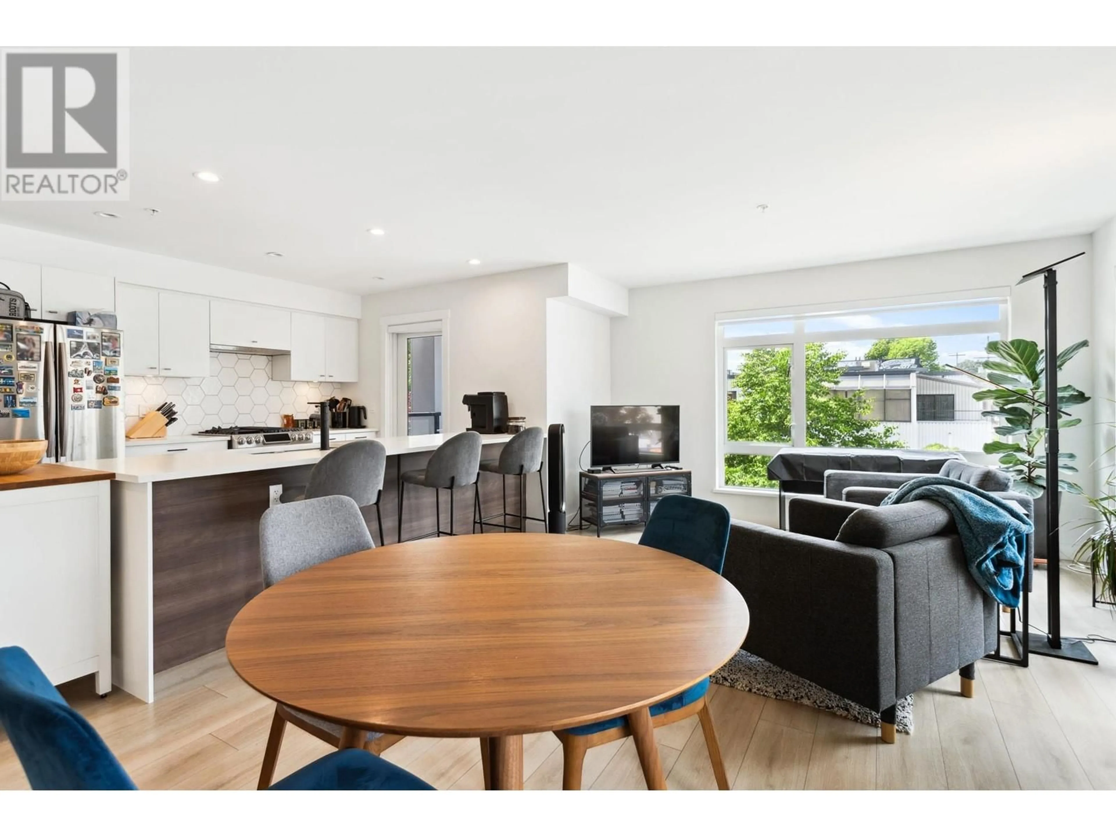 Open concept kitchen, wood/laminate floor for 208 - 1519 CROWN STREET, North Vancouver British Columbia V7J1G6