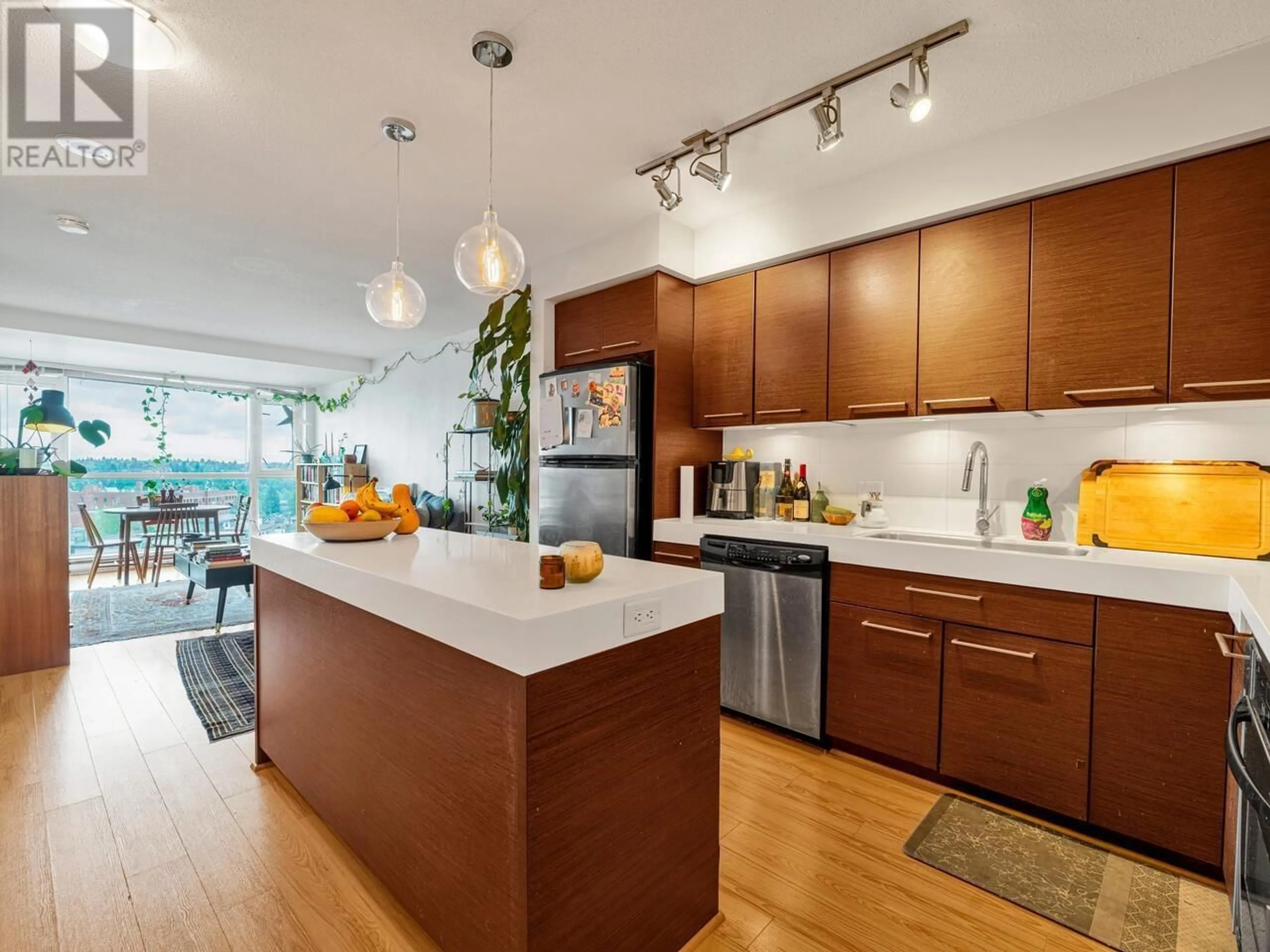 Open concept kitchen, wood/laminate floor for 1007 - 2770 SOPHIA STREET, Vancouver British Columbia V5T0A4