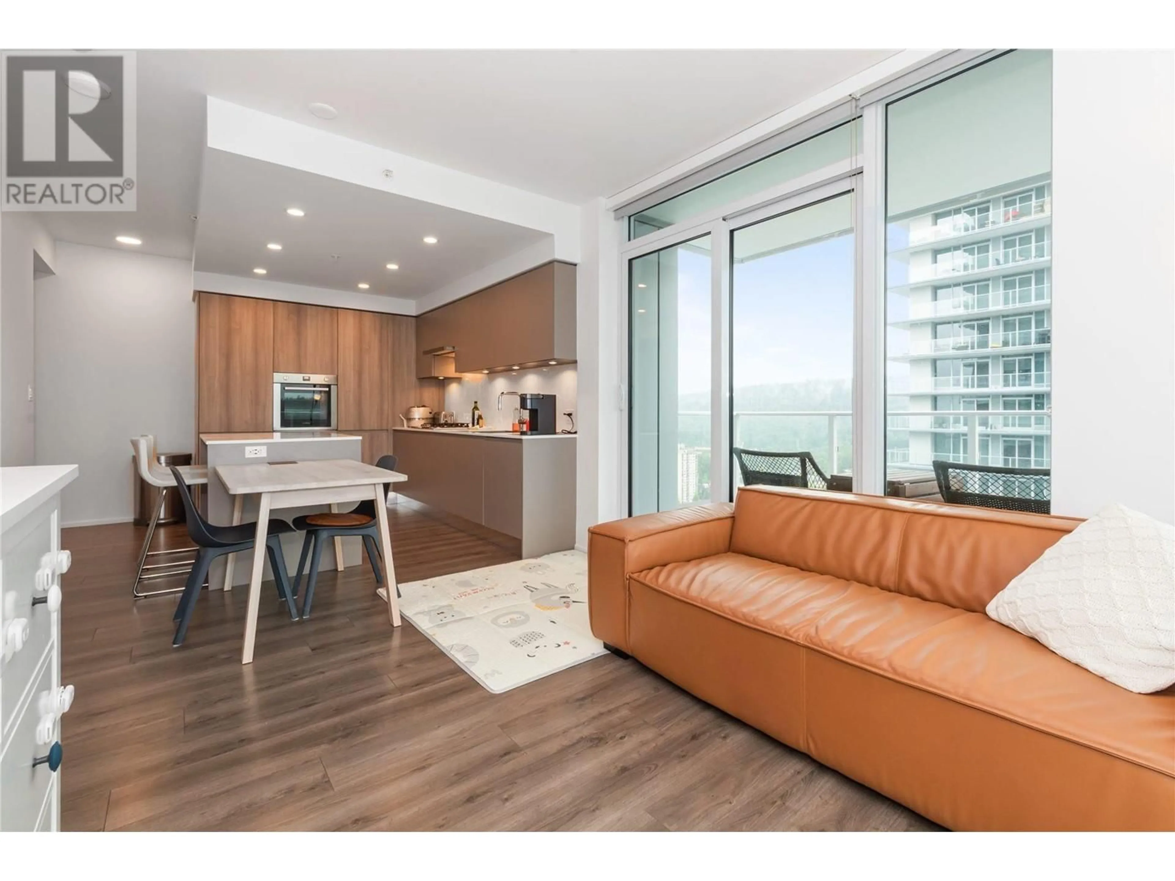 Living room with furniture, wood/laminate floor for 2801 - 3833 EVERGREEN PLACE, Burnaby British Columbia V3J0M2