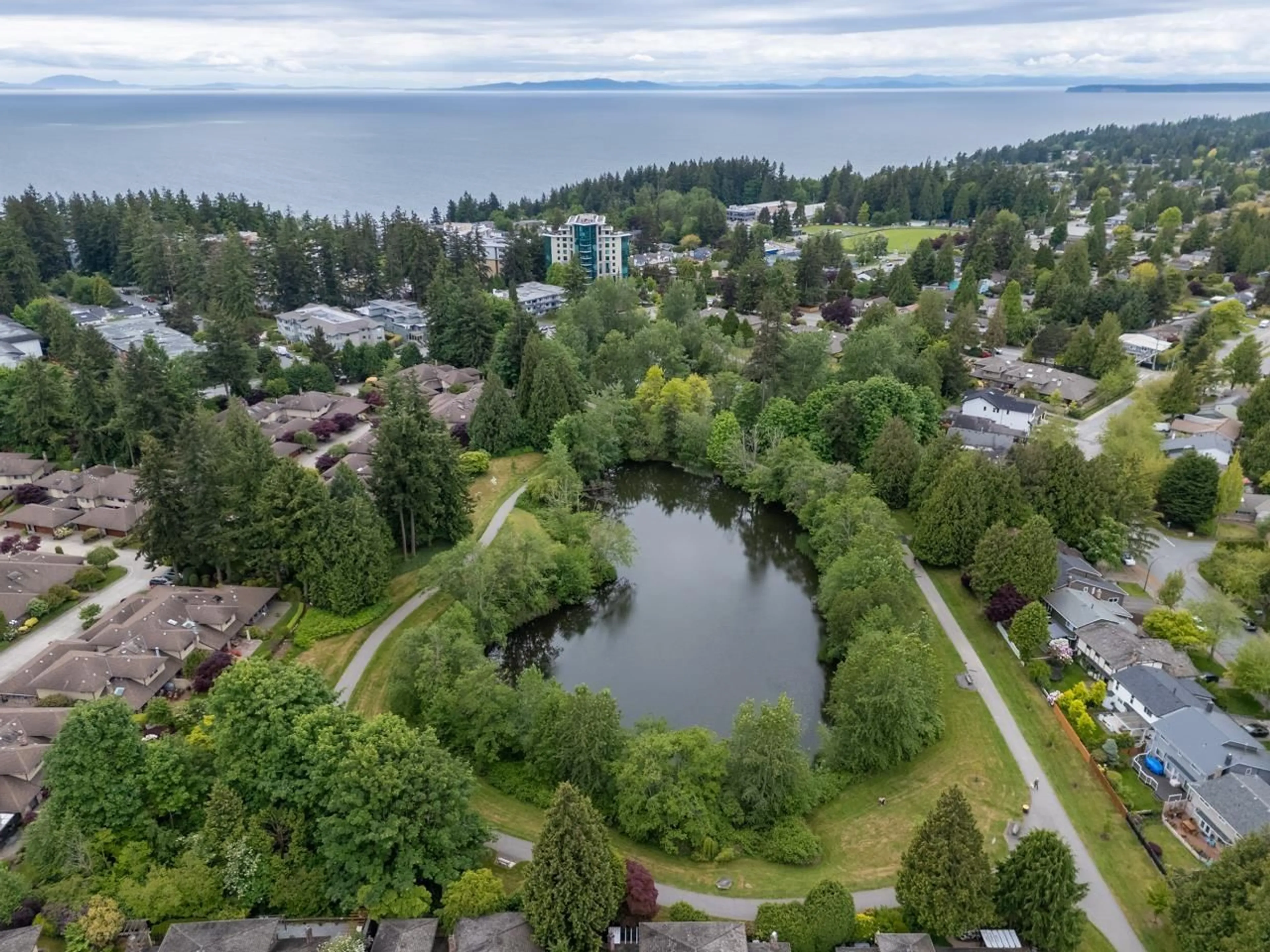A pic from outside/outdoor area/front of a property/back of a property/a pic from drone, water/lake/river/ocean view for 205 - 1720 SOUTHMERE, Surrey British Columbia V4A6E3