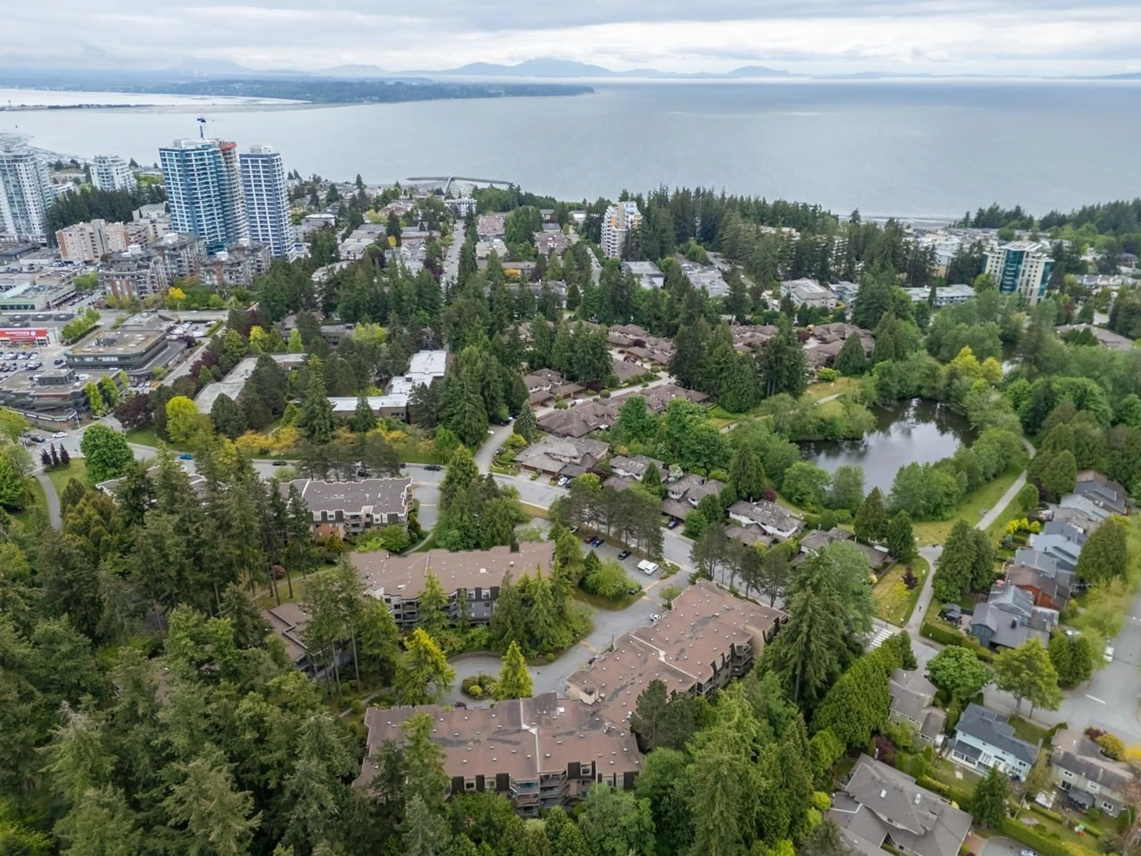 A pic from outside/outdoor area/front of a property/back of a property/a pic from drone, water/lake/river/ocean view for 205 - 1720 SOUTHMERE, Surrey British Columbia V4A6E3