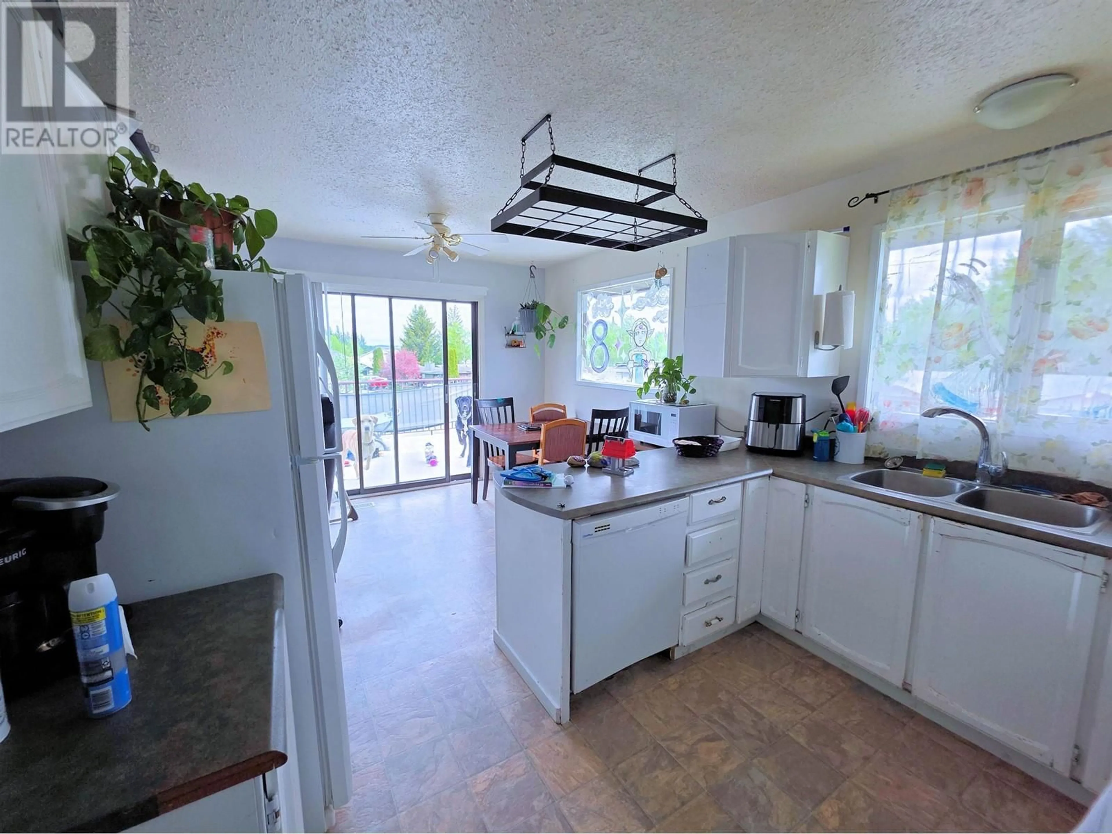 Open concept kitchen, ceramic/tile floor for 7573 ST PATRICK AVENUE, Prince George British Columbia V2N4C7