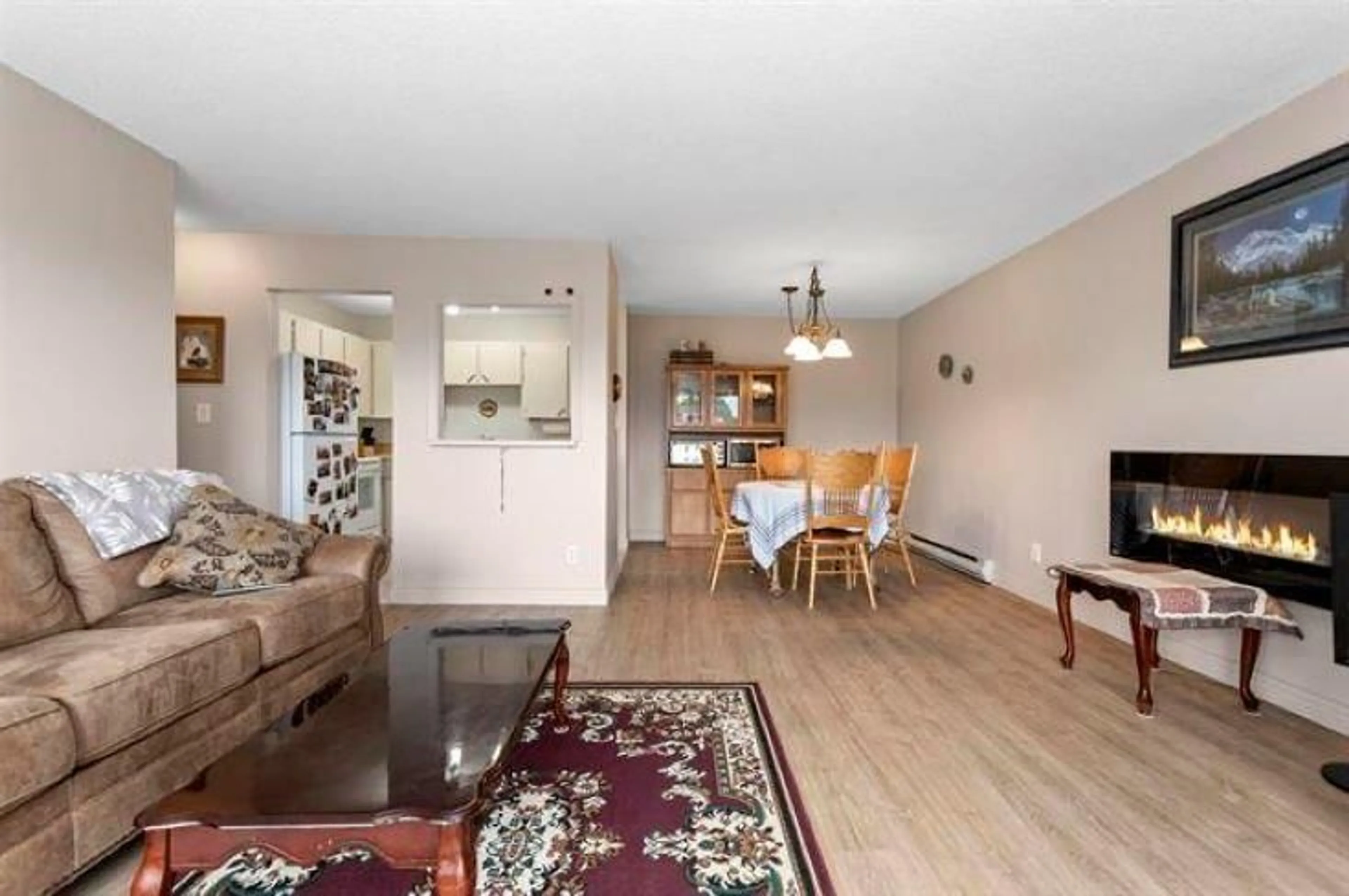 Living room with furniture, wood/laminate floor for 207 - 9080 MARY STREET, Chilliwack British Columbia V2P4J1